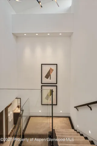 a view of a workspace with furniture and wooden floor
