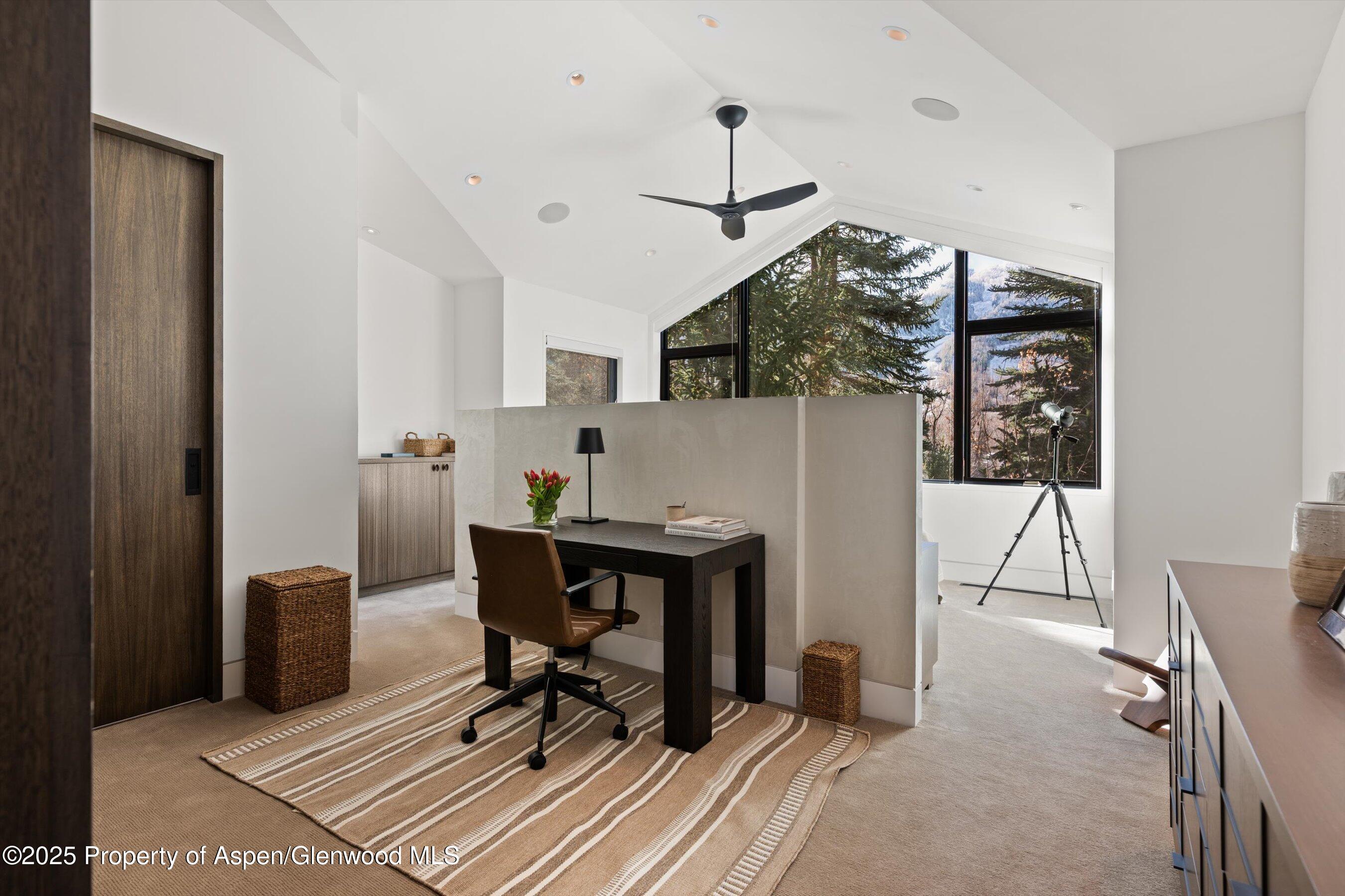 155 Lone Pine Road, Unit 12 Aspen, CO 81611 - Photo 22 of 37 a view of a workspace with furniture and wooden floor