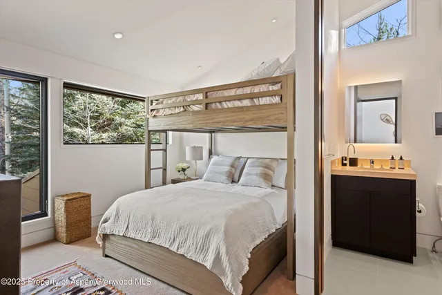 a view of a house with a yard balcony and sitting area