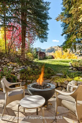 a view of a lawn chairs and a fire pit