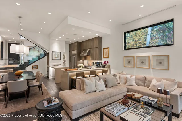 a living room with furniture and a painting