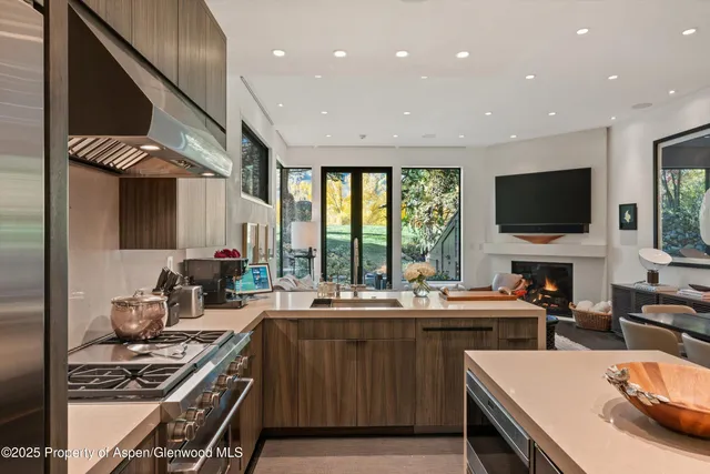 a kitchen with a sink appliances and a counter top space