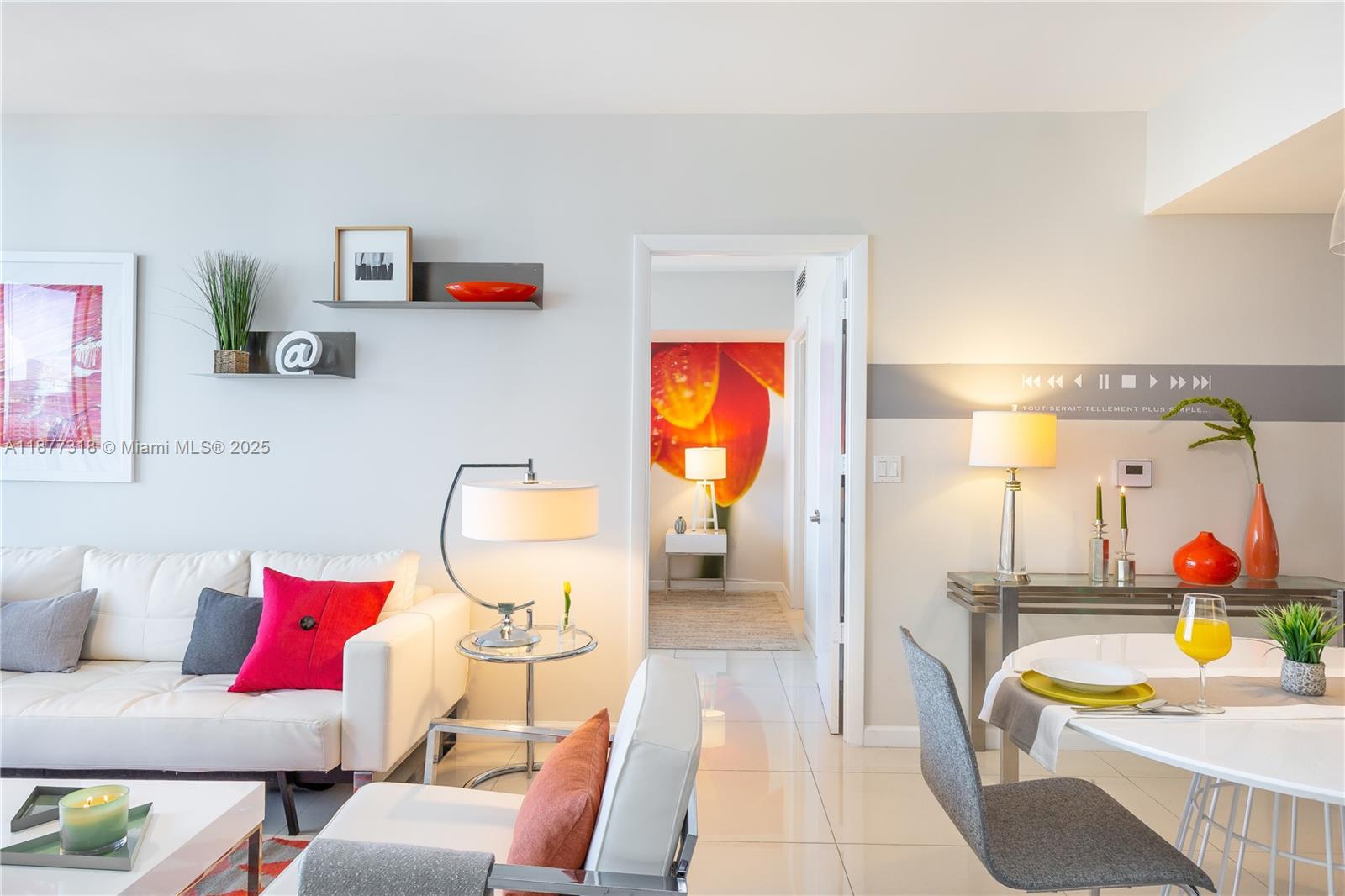 485 Brickell Avenue, Unit 4101 Miami, FL 33131 - Photo 11 of 14 a living room with furniture and a flat screen tv