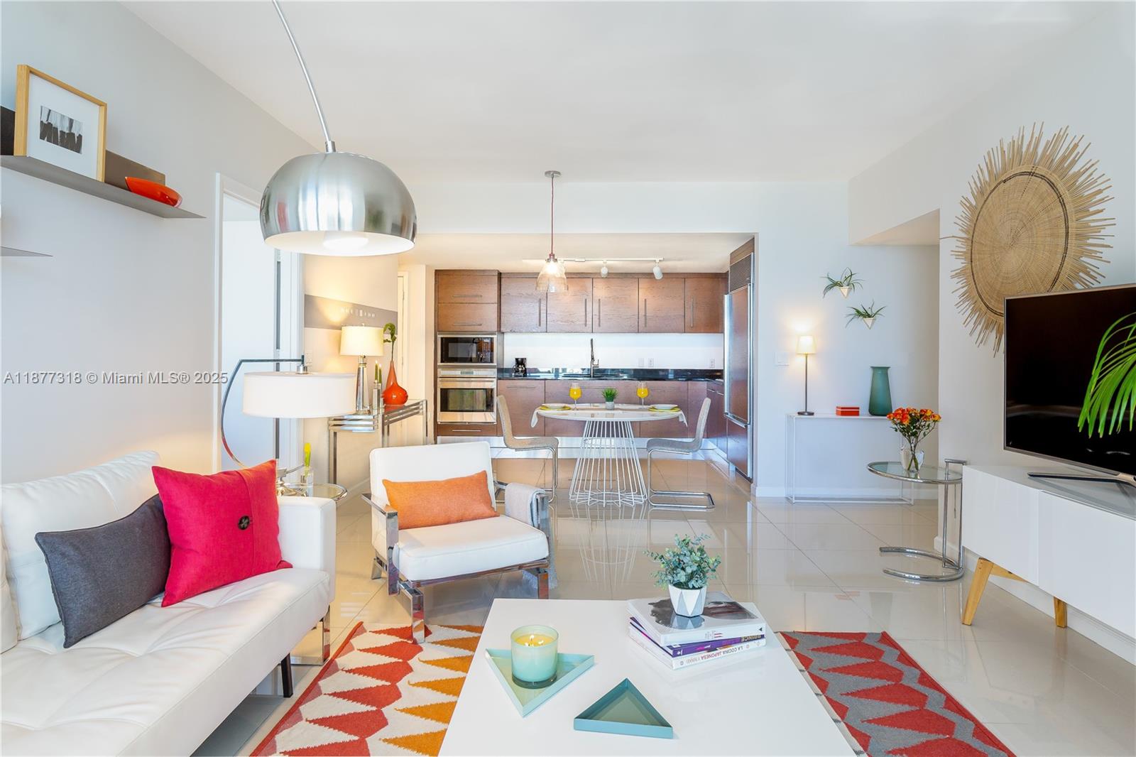 485 Brickell Avenue, Unit 4101 Miami, FL 33131 - Photo 12 of 14 a living room with furniture and a chandelier