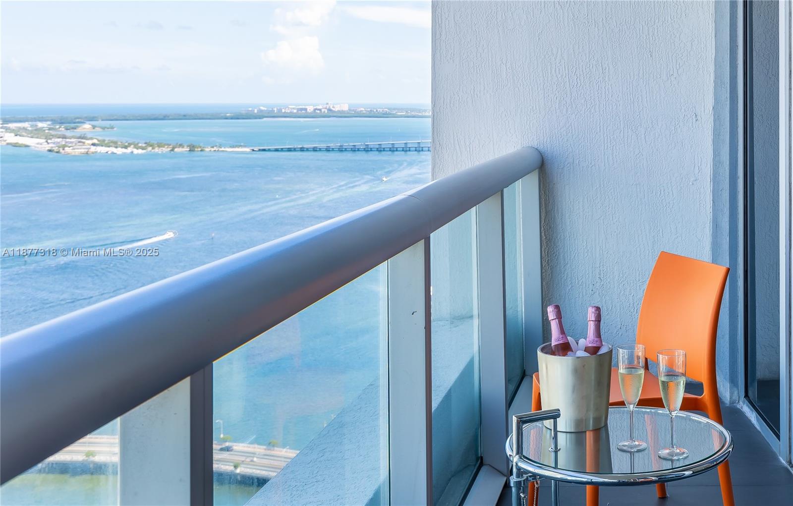 485 Brickell Avenue, Unit 4101 Miami, FL 33131 - Photo 3 of 14 a view of a balcony with furniture and wooden floor