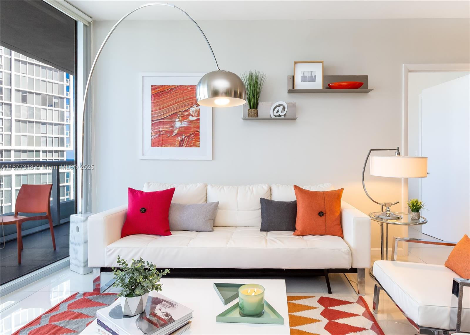 485 Brickell Avenue, Unit 4101 Miami, FL 33131 - Photo 4 of 14 a bedroom with furniture and a wooden floor