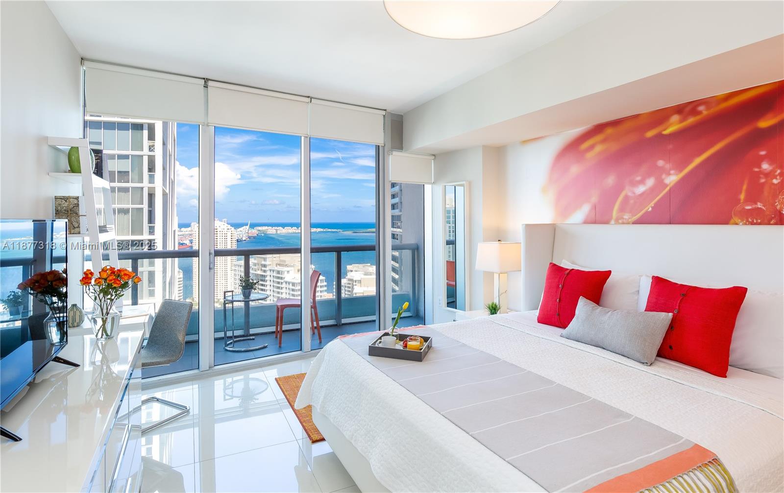 485 Brickell Avenue, Unit 4101 Miami, FL 33131 - Photo 6 of 14 a bed sitting in a bedroom next to a window