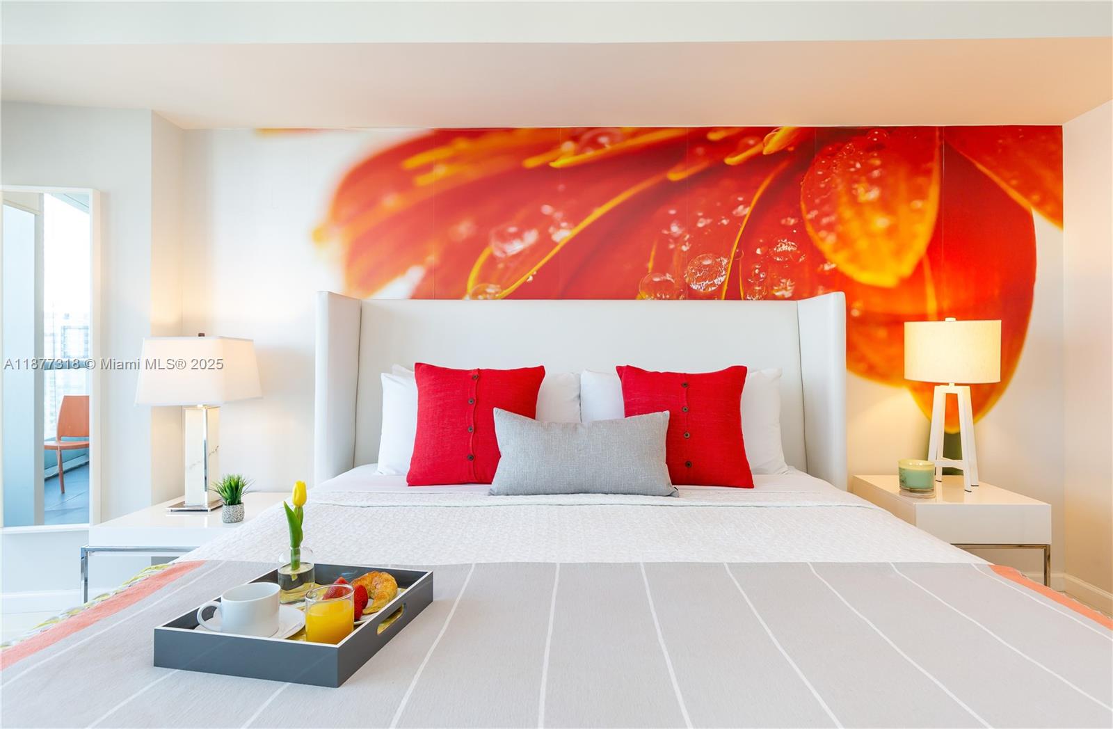 485 Brickell Avenue, Unit 4101 Miami, FL 33131 - Photo 7 of 14 a bedroom with a large bed and a wooden floor