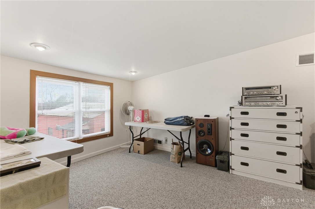 11379 Friend Road Germantown, OH 45327 - Photo 28 of 44 This spacious room offers versatile living with ample natural light, ideal for various uses.