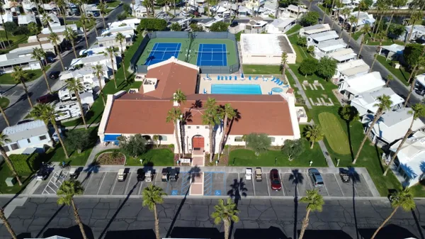 an aerial view of multiple houses with yard