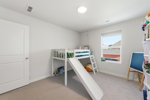 1038 South Old Towne Road Layton, UT 84041 - Photo 25 of 39 Carpeted room featuring light gray walls, a single window, white trim, and a flush-mount ceiling light fixture