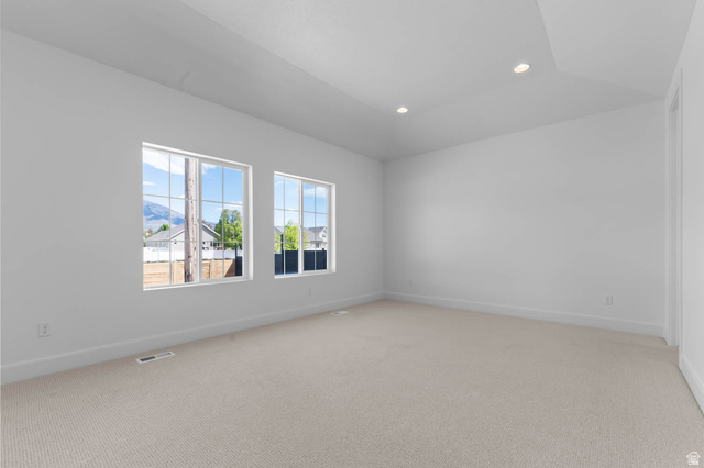 11711 South Halls Crk Road Draper, UT 84020 - Photo 20 of 31 Spare room featuring light carpet, recessed lighting, and lofted ceiling