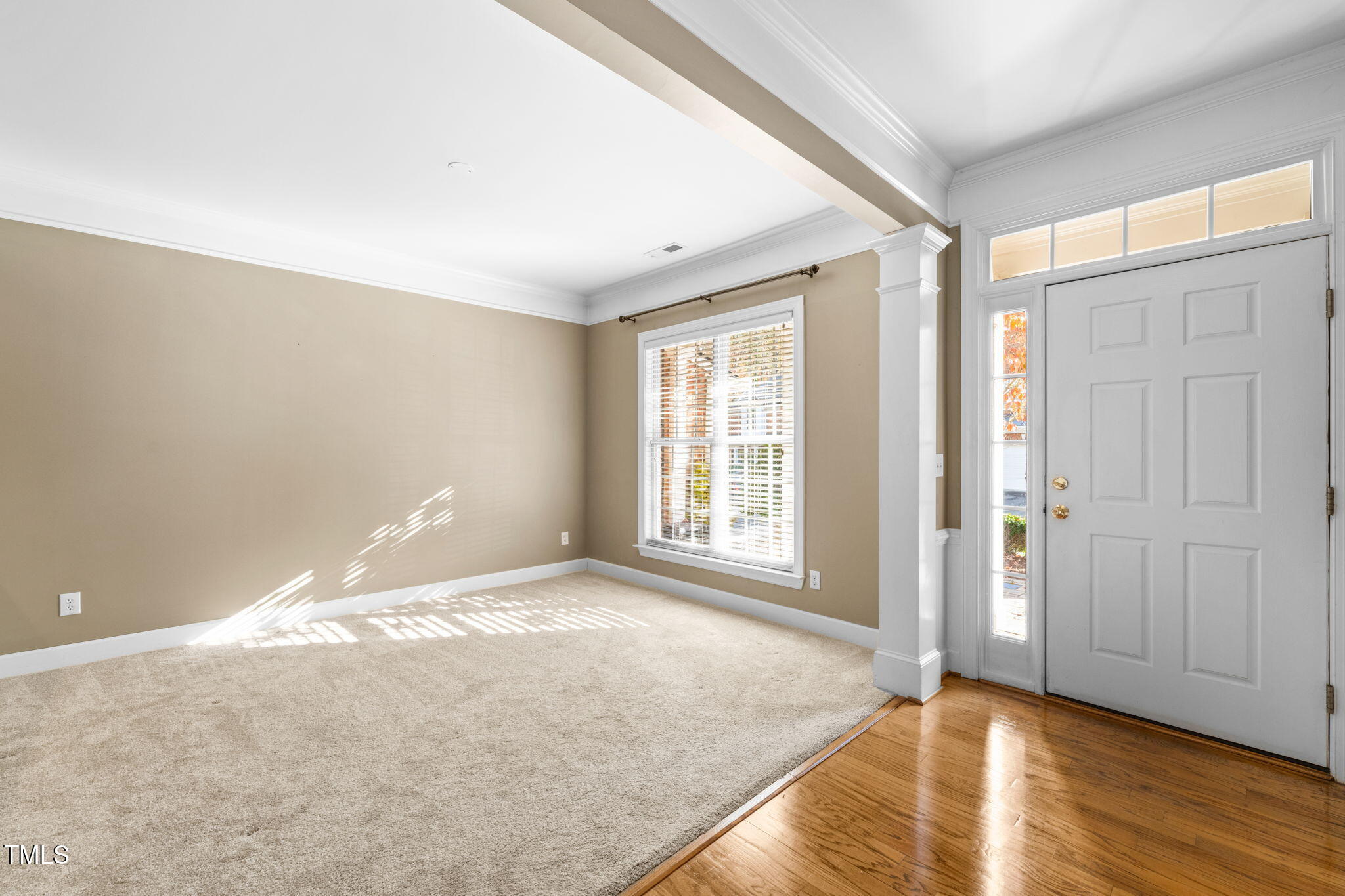 3614 Lion Ridge Court Raleigh, NC 27612 - Photo 11 of 52 a view of an empty room with wooden floor and a window