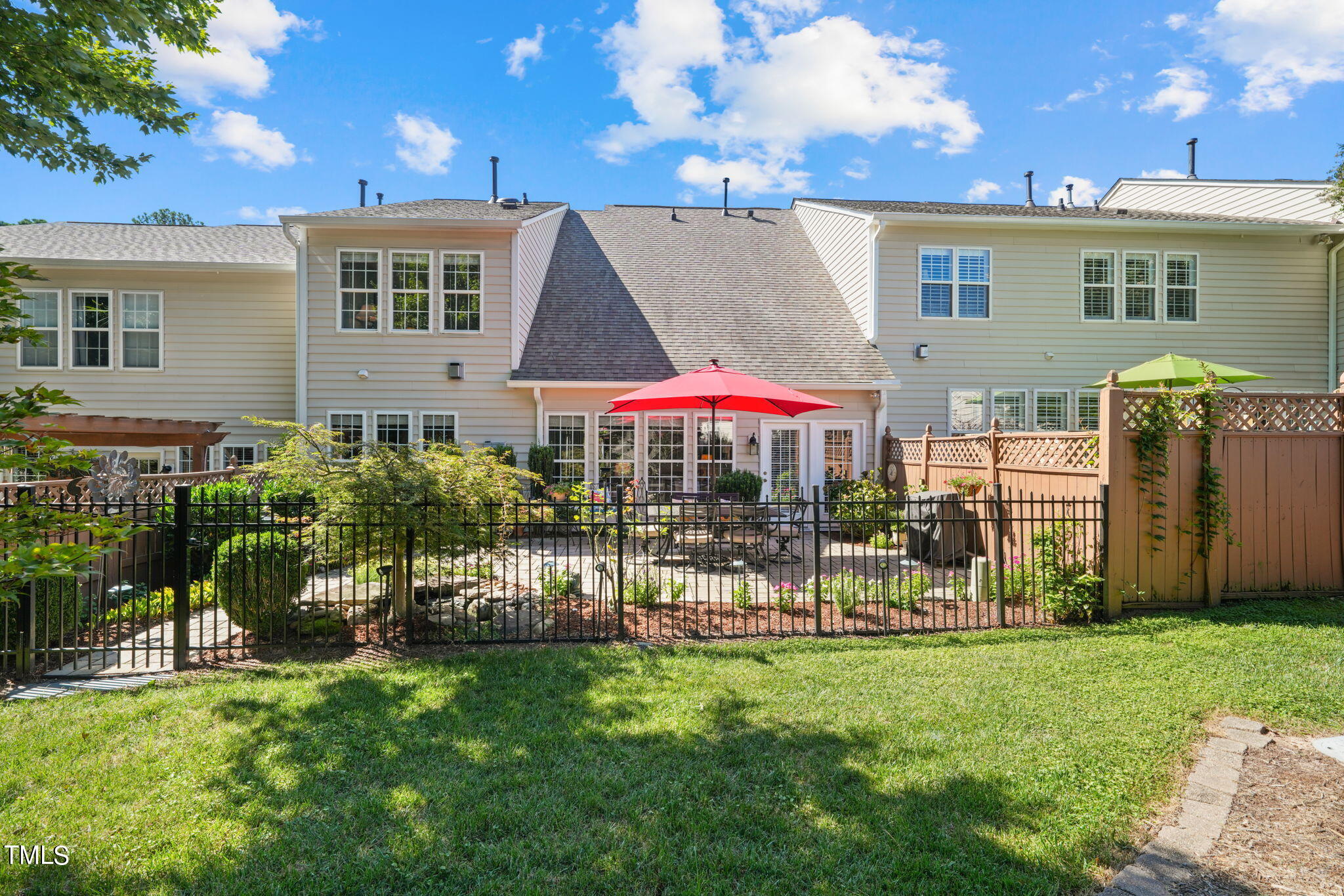 3614 Lion Ridge Court Raleigh, NC 27612 - Photo 50 of 52 a front view of a house with a garden