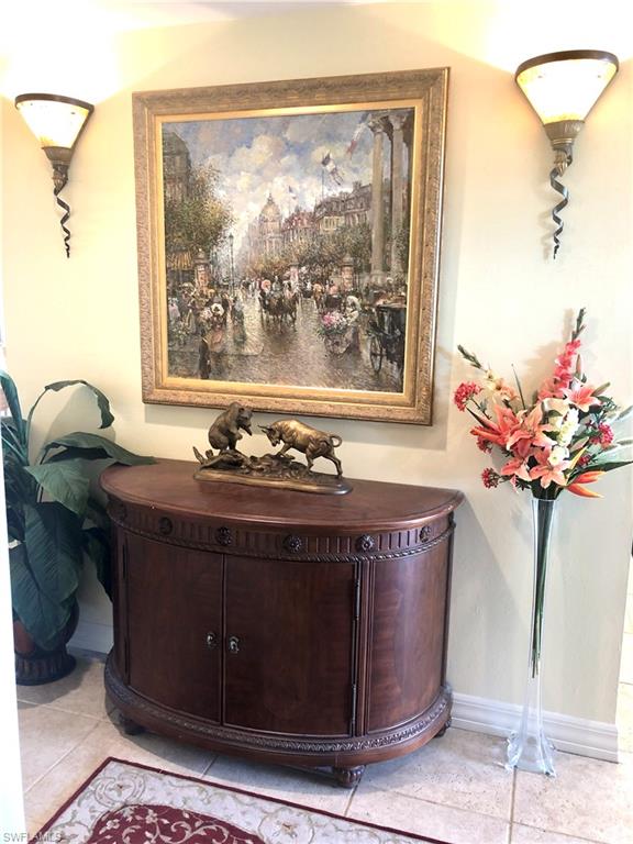 451 Bayfront Place, Unit 5311 Naples, FL 34102 - Photo 11 of 38 a view of a fireplace with a vase and a vase on it