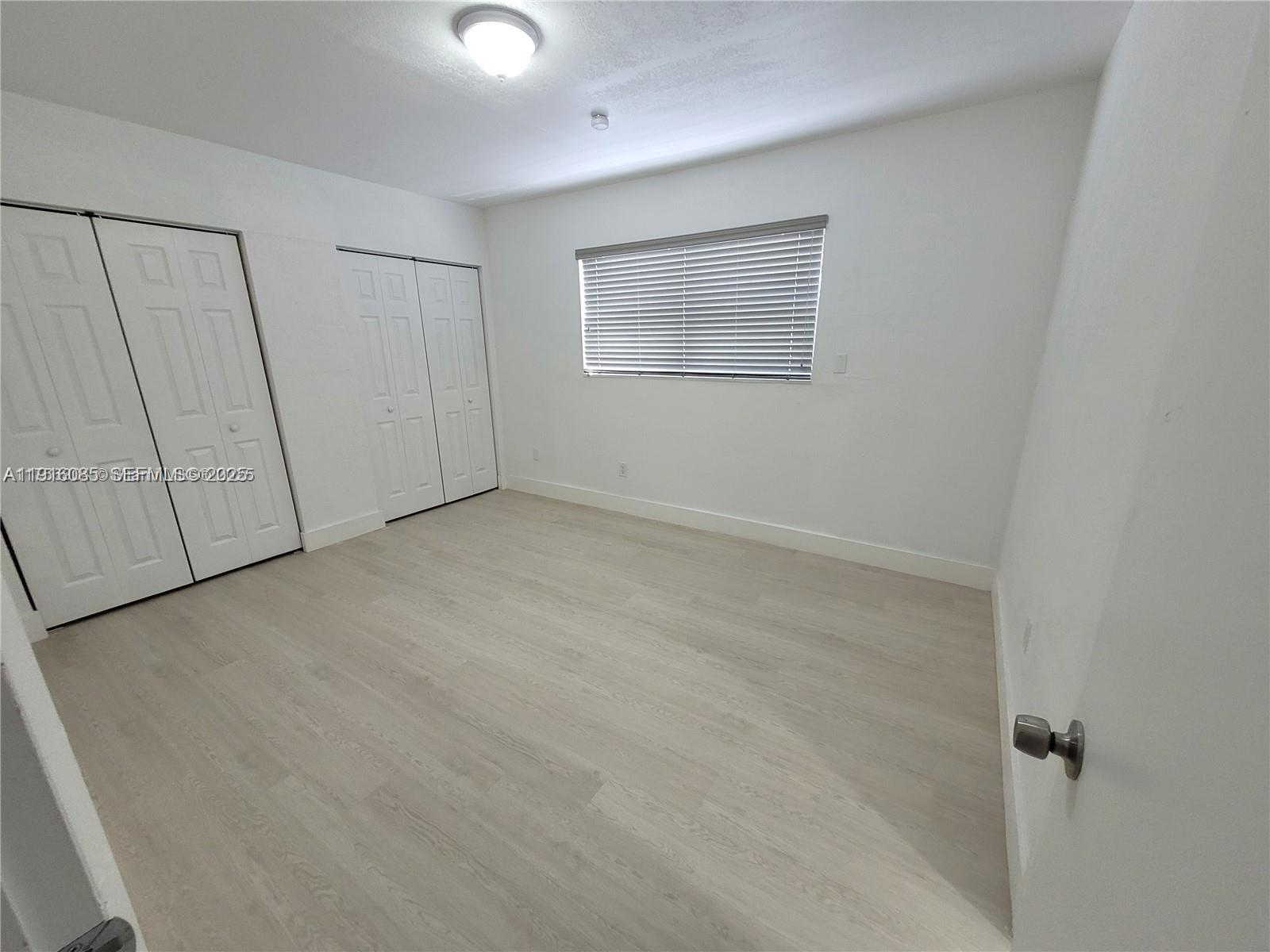 637 West 31st Street Hialeah, FL 33012 - Photo 12 of 20 a view of an empty room with a window