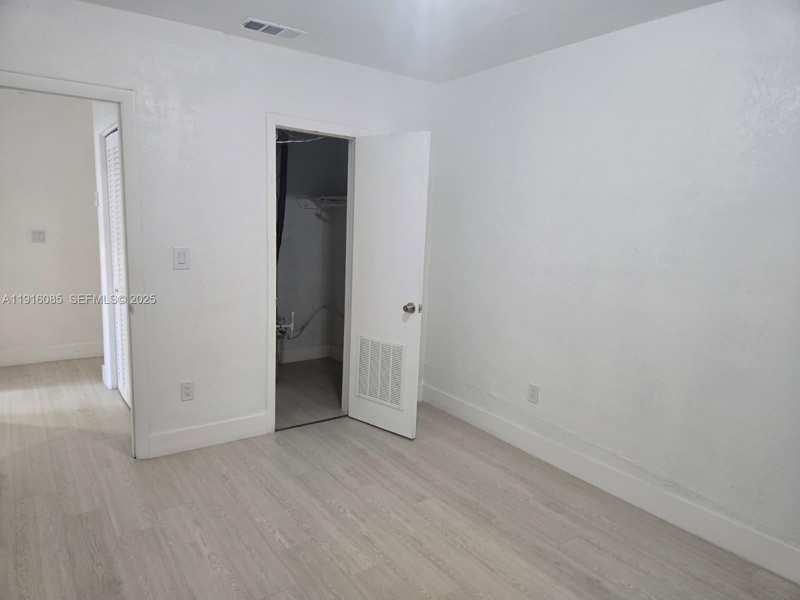 637 West 31st Street Hialeah, FL 33012 - Photo 17 of 20 an empty room with closet area