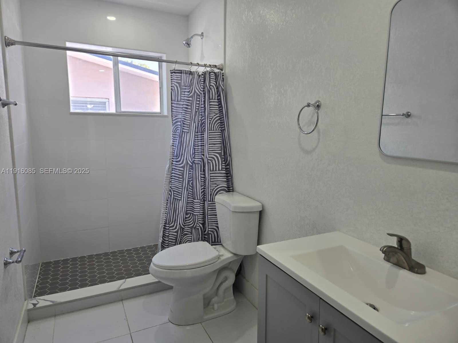 637 West 31st Street Hialeah, FL 33012 - Photo 19 of 20 a bathroom with a sink toilet and shower
