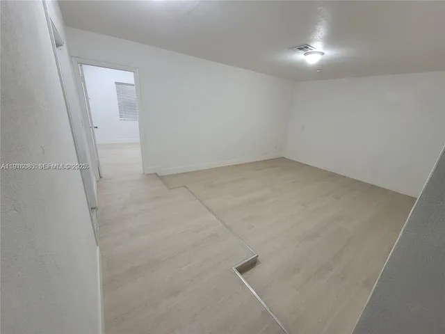 an empty room with a workbench