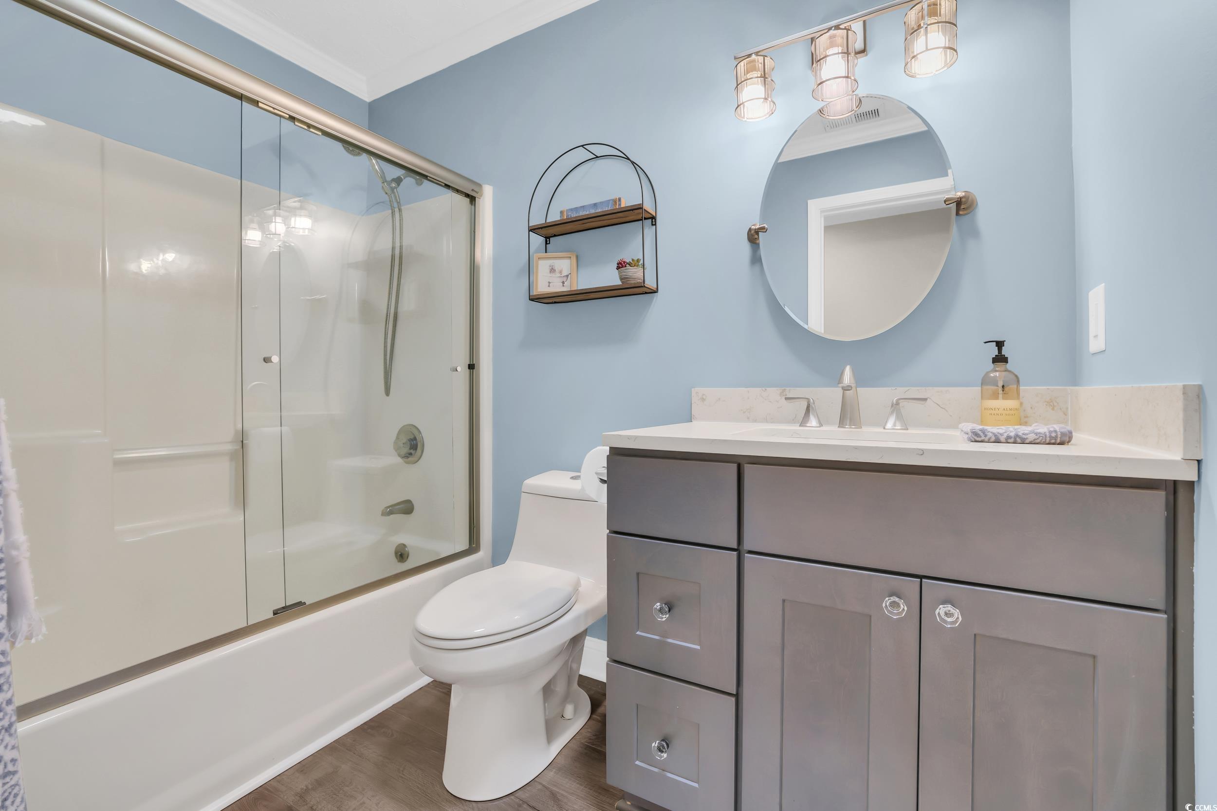 442 Deer Watch Circle Longs, SC 29568 - Photo 15 of 40 Full bath featuring shower / bath combination with glass door, vanity, and wood finished floors