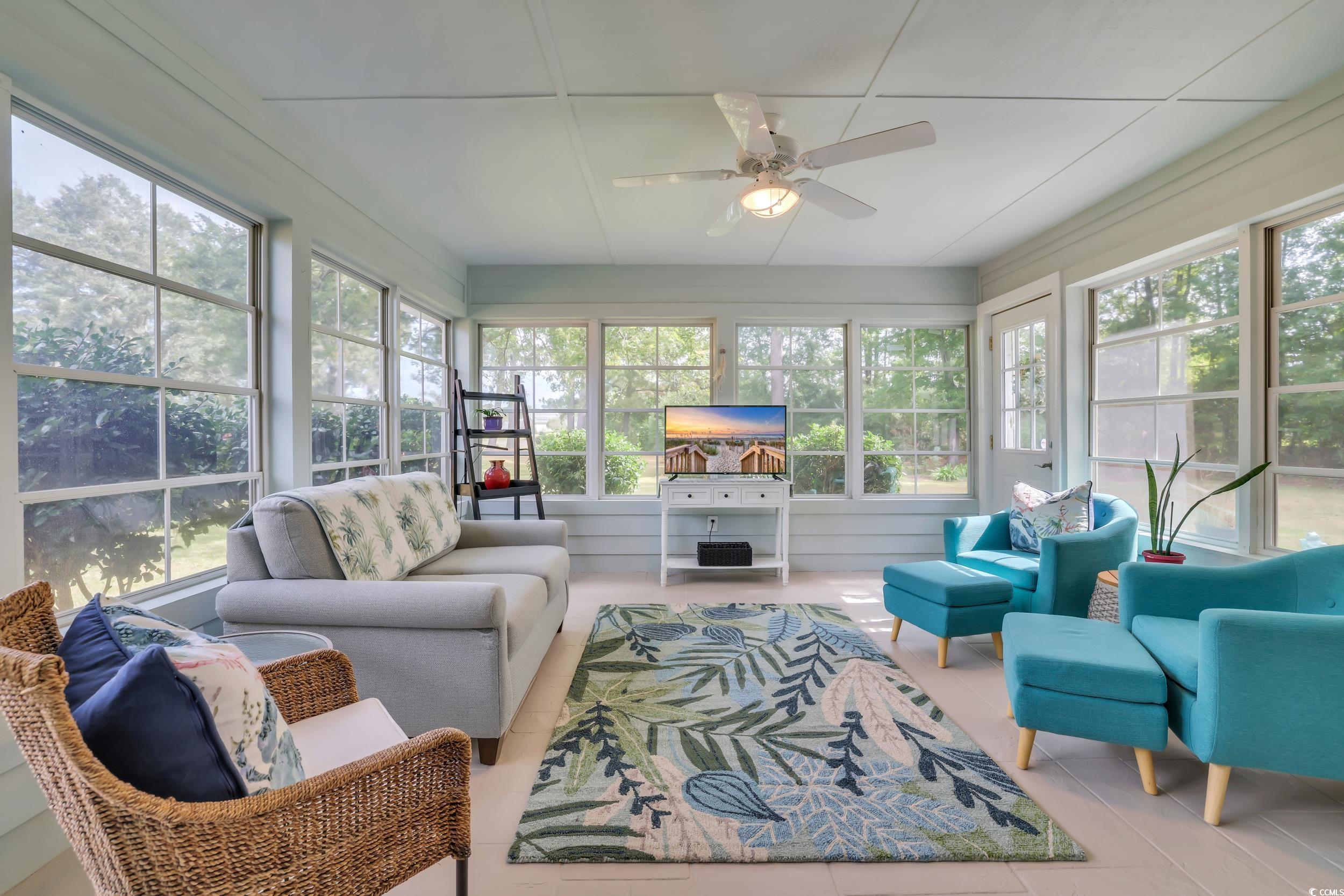 442 Deer Watch Circle Longs, SC 29568 - Photo 24 of 40 Sunroom / solarium with outdoor lounge area, a ceiling fan, and tile patterned floors