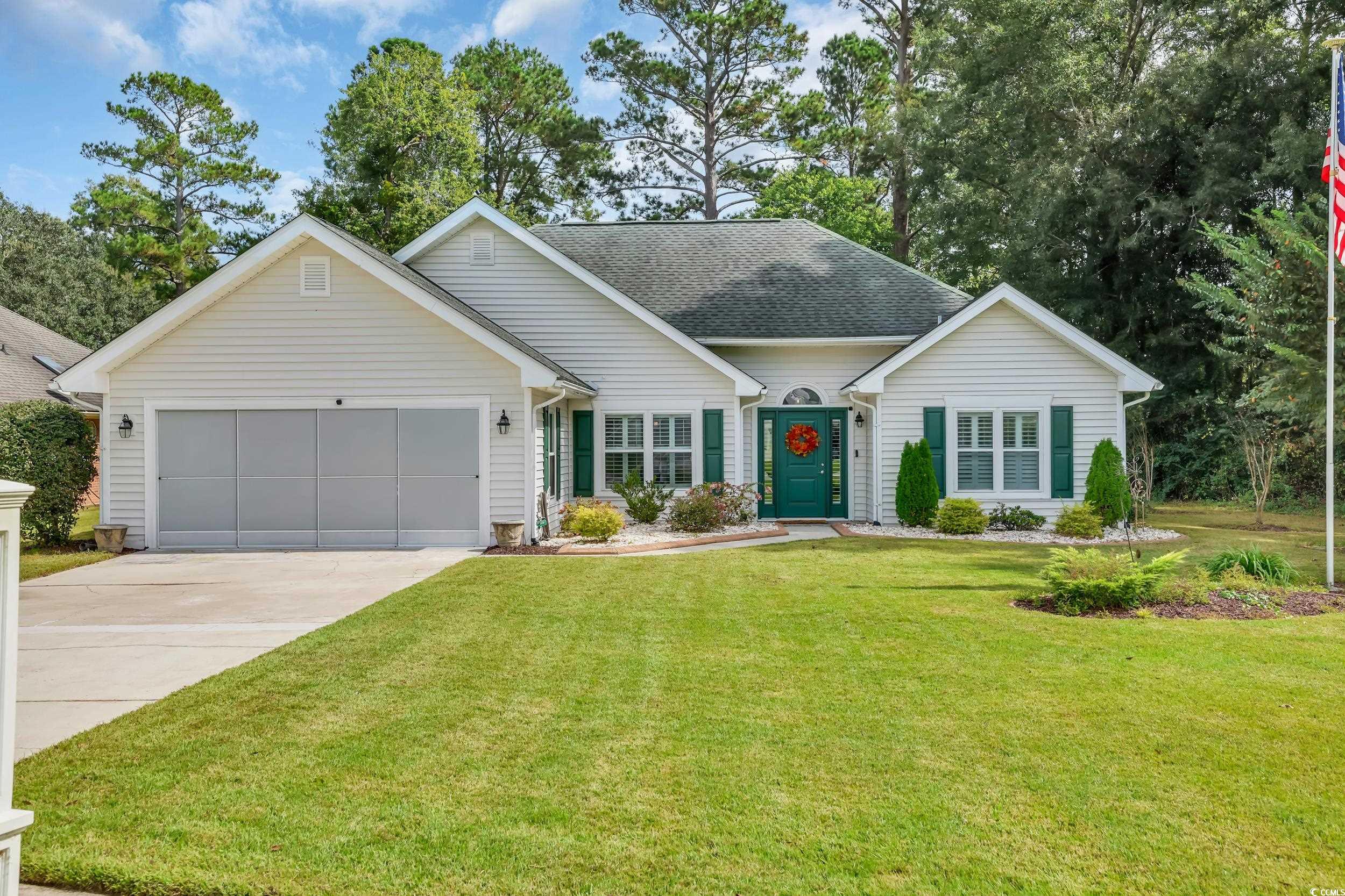 442 Deer Watch Circle Longs, SC 29568 - Photo 4 of 40 Ranch-style home featuring a front lawn, a shingled roof, concrete driveway, and an attached garage