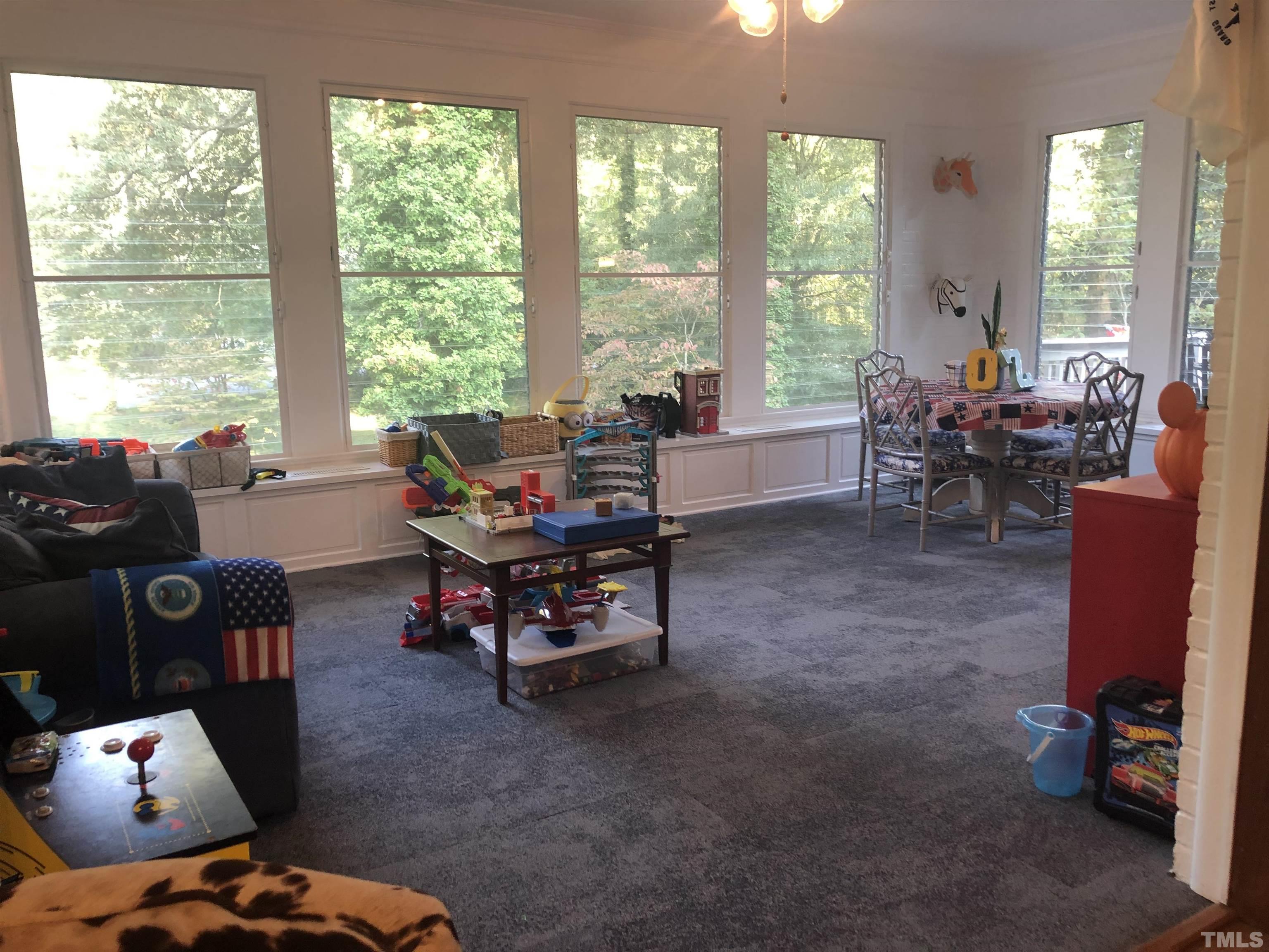 910 Marrow Drive Henderson, NC 27536 - Photo 14 of 30 a living room with furniture and floor to ceiling windows