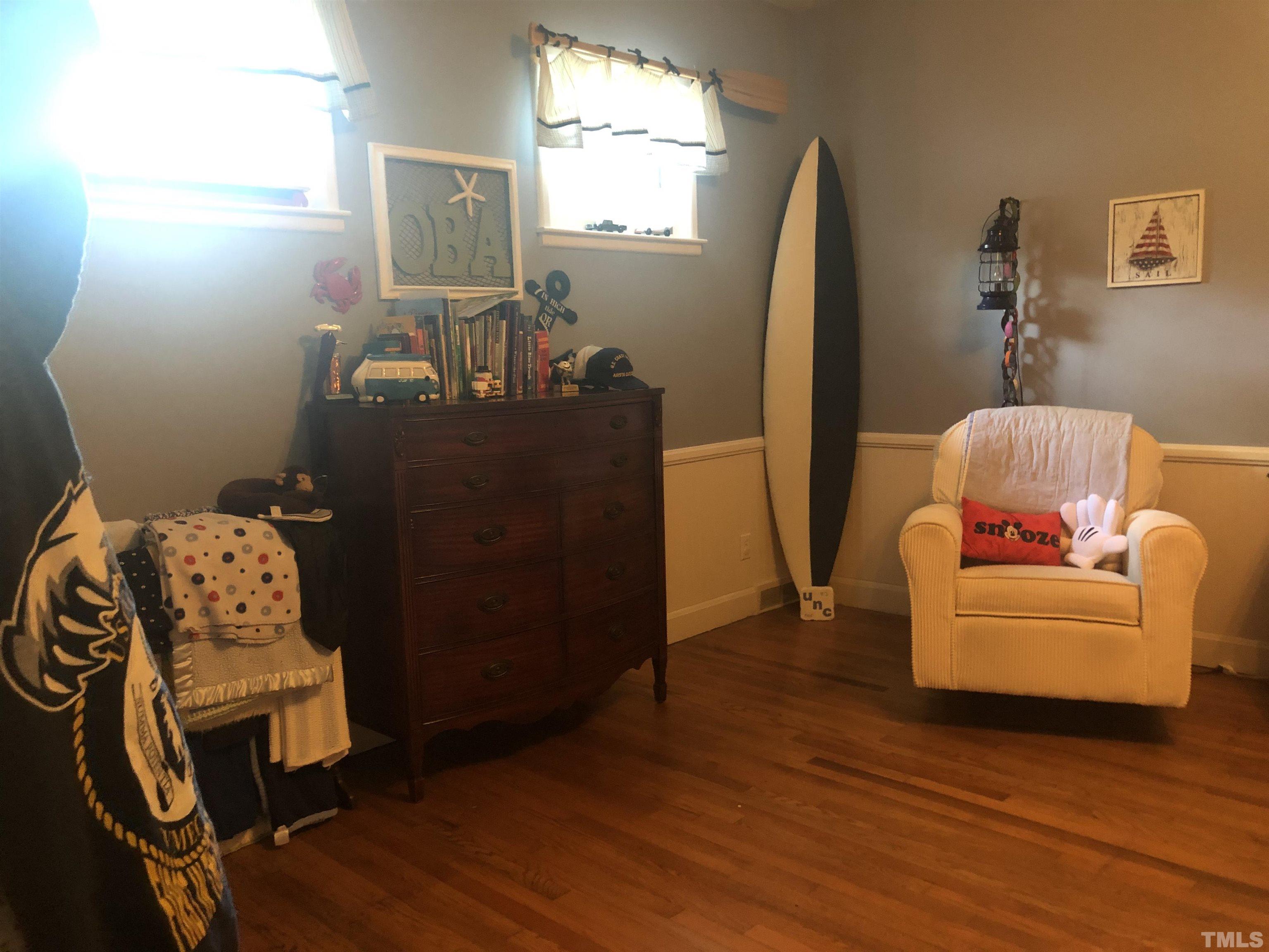 910 Marrow Drive Henderson, NC 27536 - Photo 23 of 30 a living room with furniture and a wooden floor