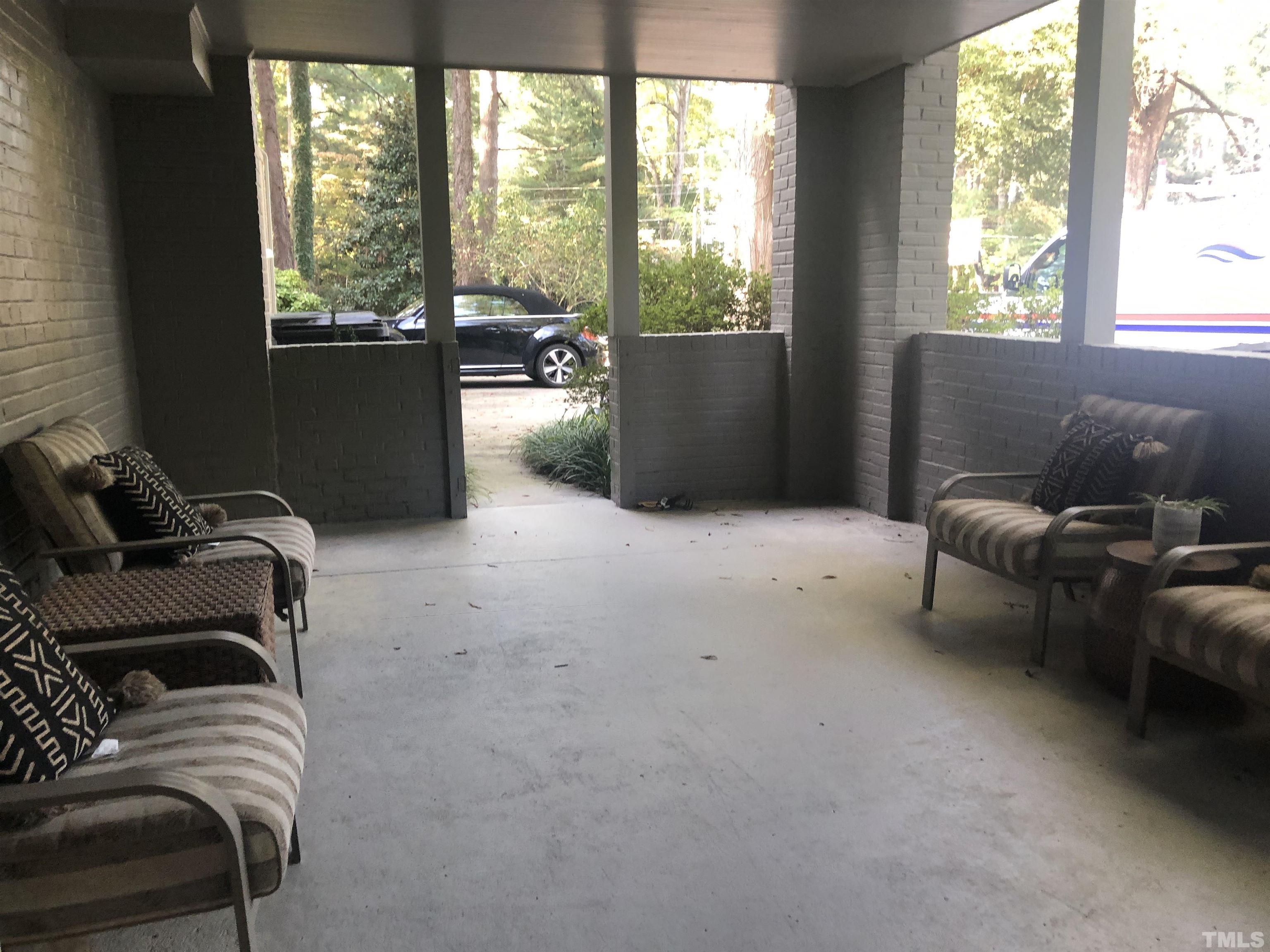 910 Marrow Drive Henderson, NC 27536 - Photo 25 of 30 a living room with furniture and a floor to ceiling window