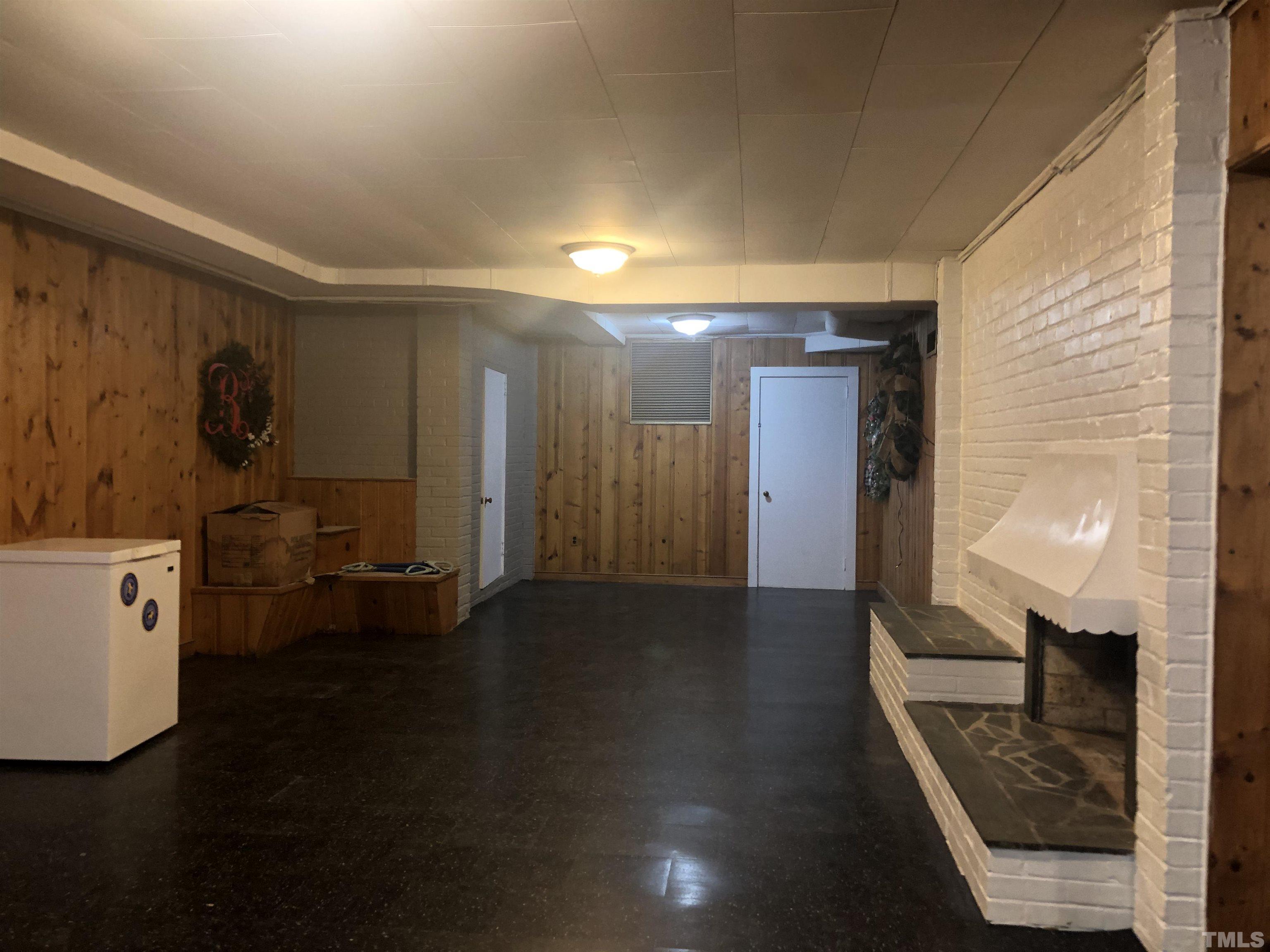 910 Marrow Drive Henderson, NC 27536 - Photo 27 of 30 a view of a hallway to a livingroom with furniture