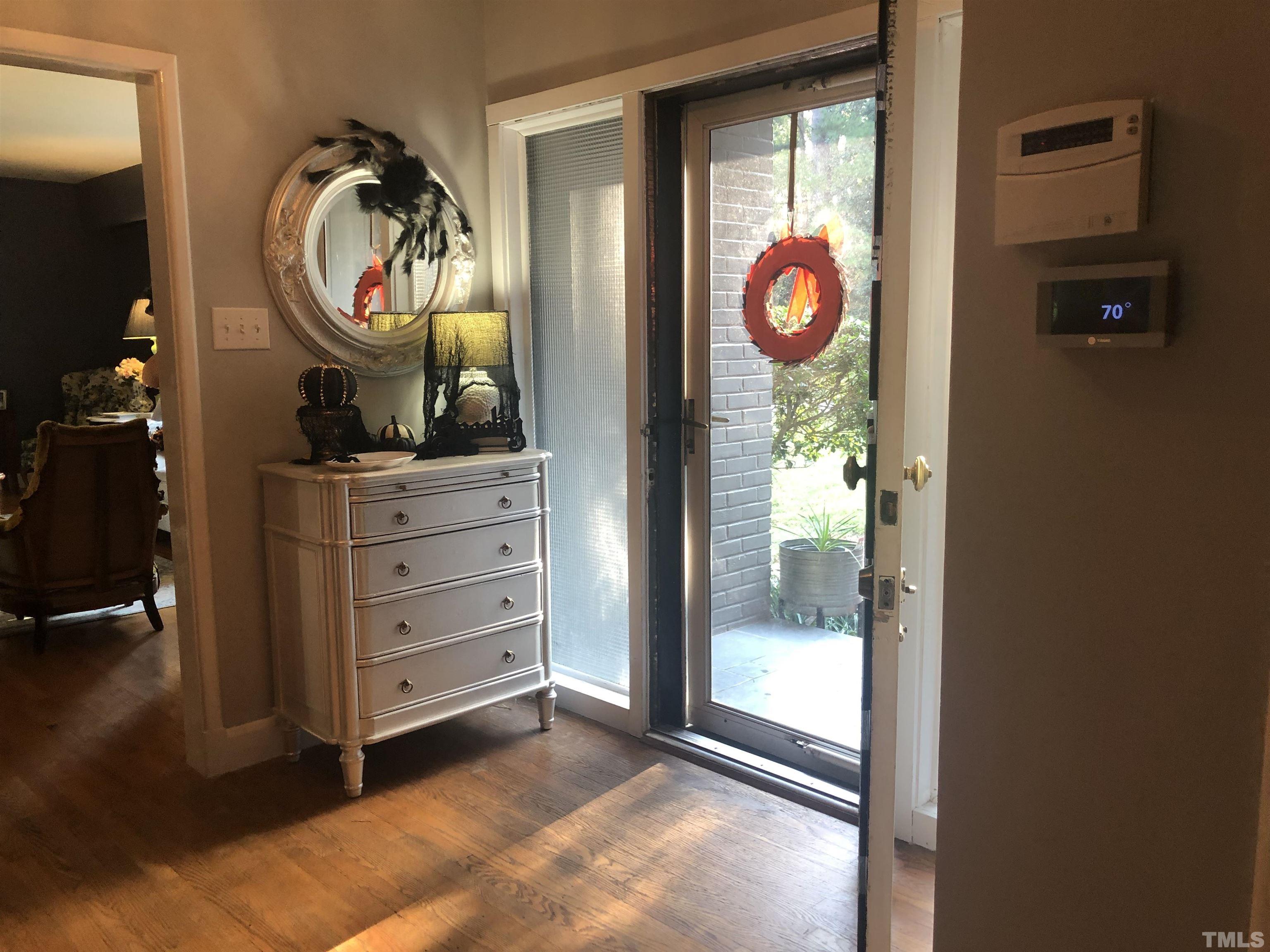 910 Marrow Drive Henderson, NC 27536 - Photo 5 of 30 a very nice looking room with a chair and mirror