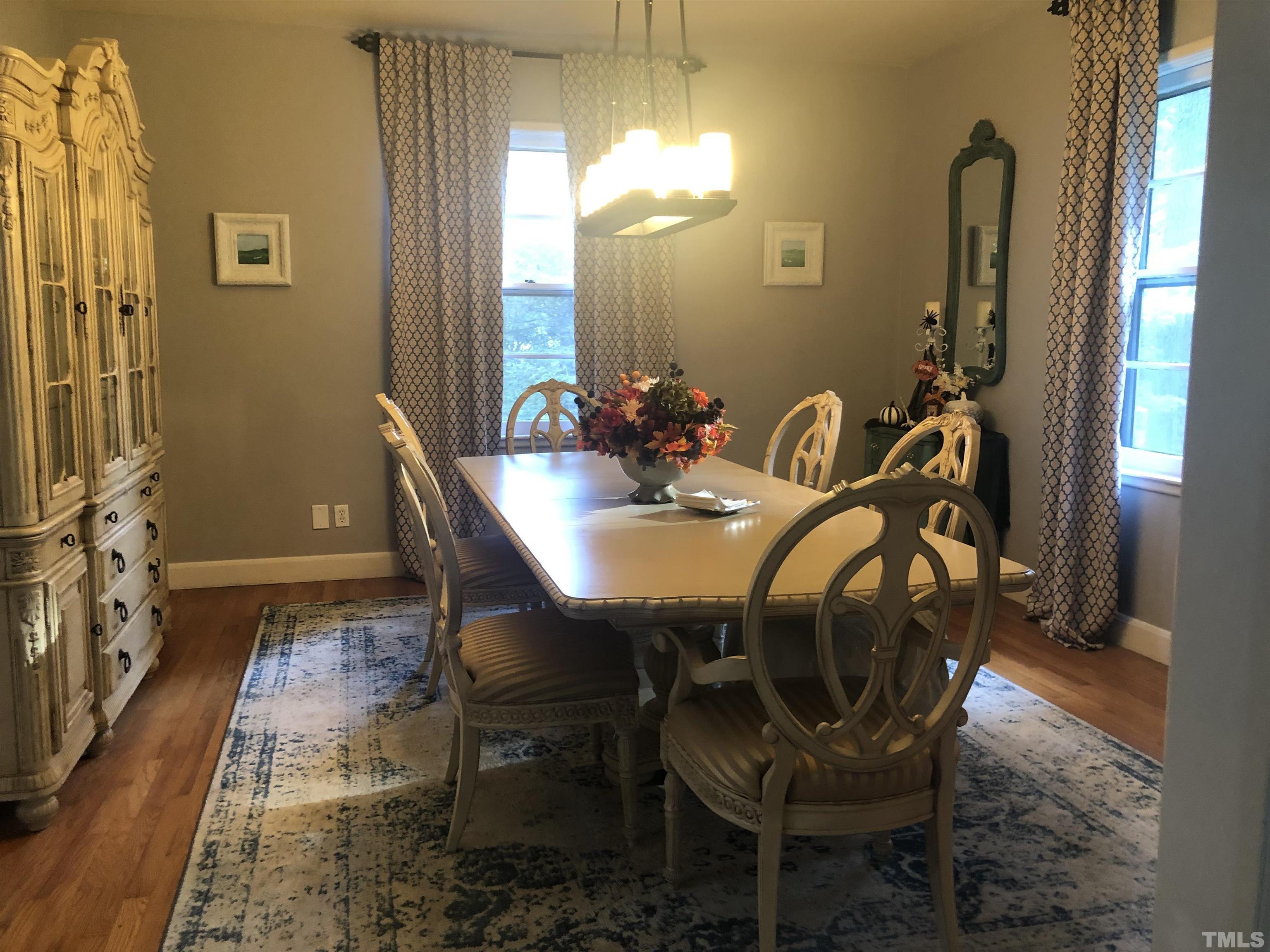 910 Marrow Drive Henderson, NC 27536 - Photo 10 of 30 a view of a dining room with furniture and window