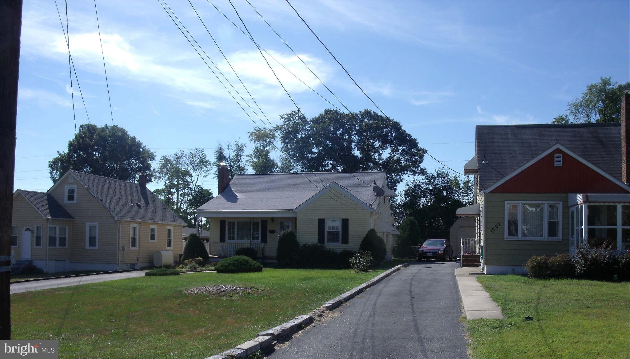 1209 Orems Road Baltimore, MD 21220 - Photo 2 of 29 a front view of a house with a garden
