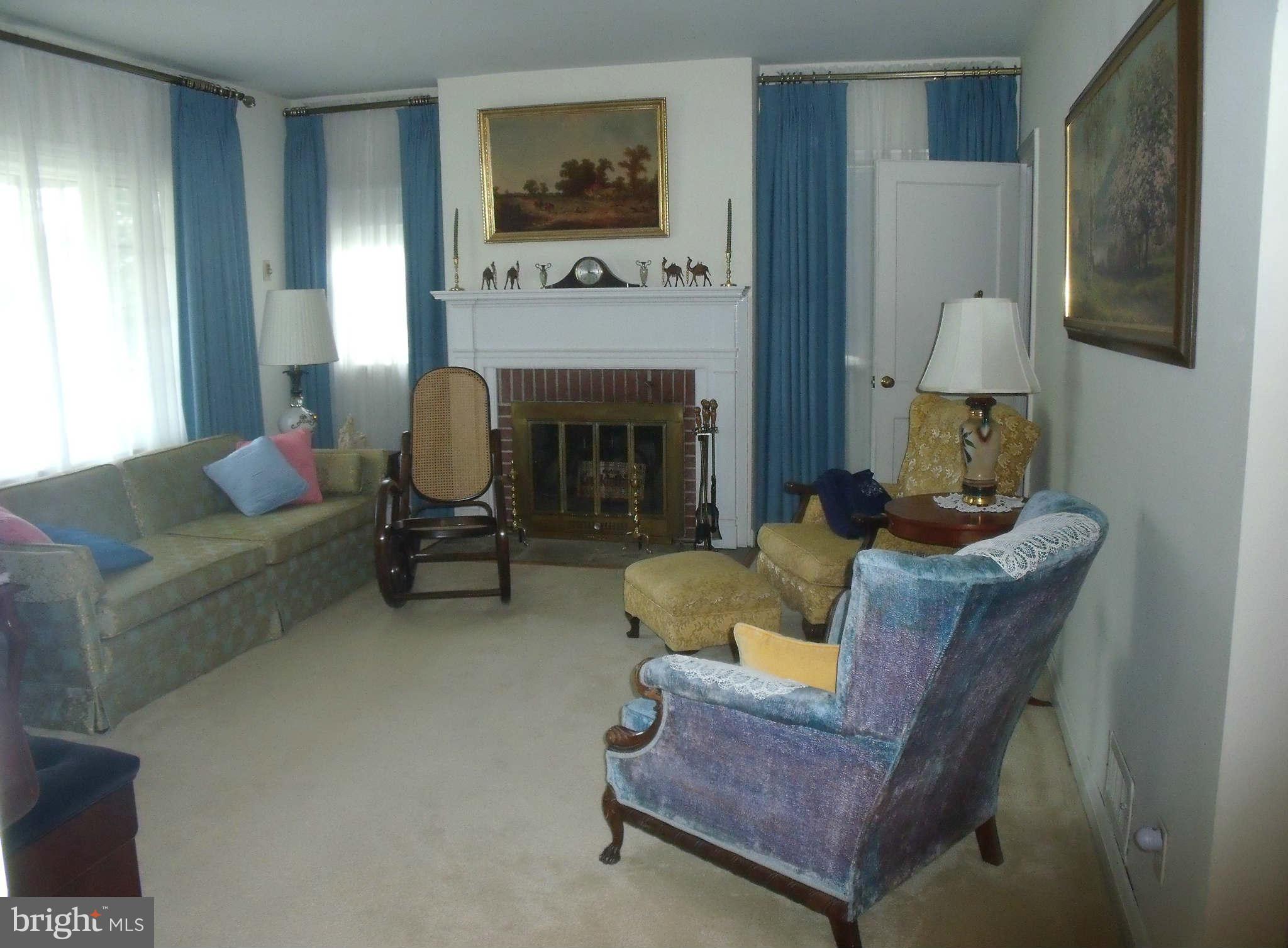 1209 Orems Road Baltimore, MD 21220 - Photo 12 of 29 a living room with furniture and a fireplace