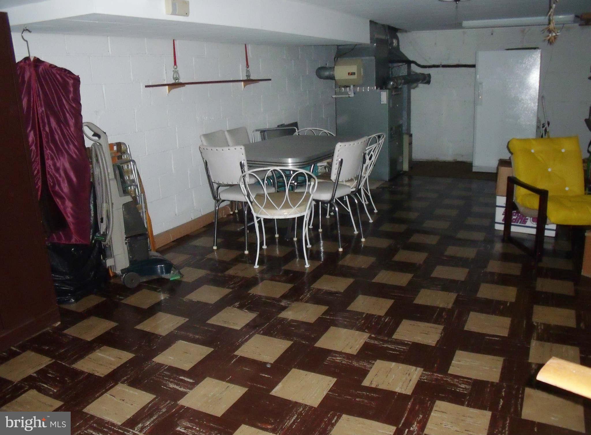 1209 Orems Road Baltimore, MD 21220 - Photo 26 of 29 a view of a dining room with furniture and chandelier