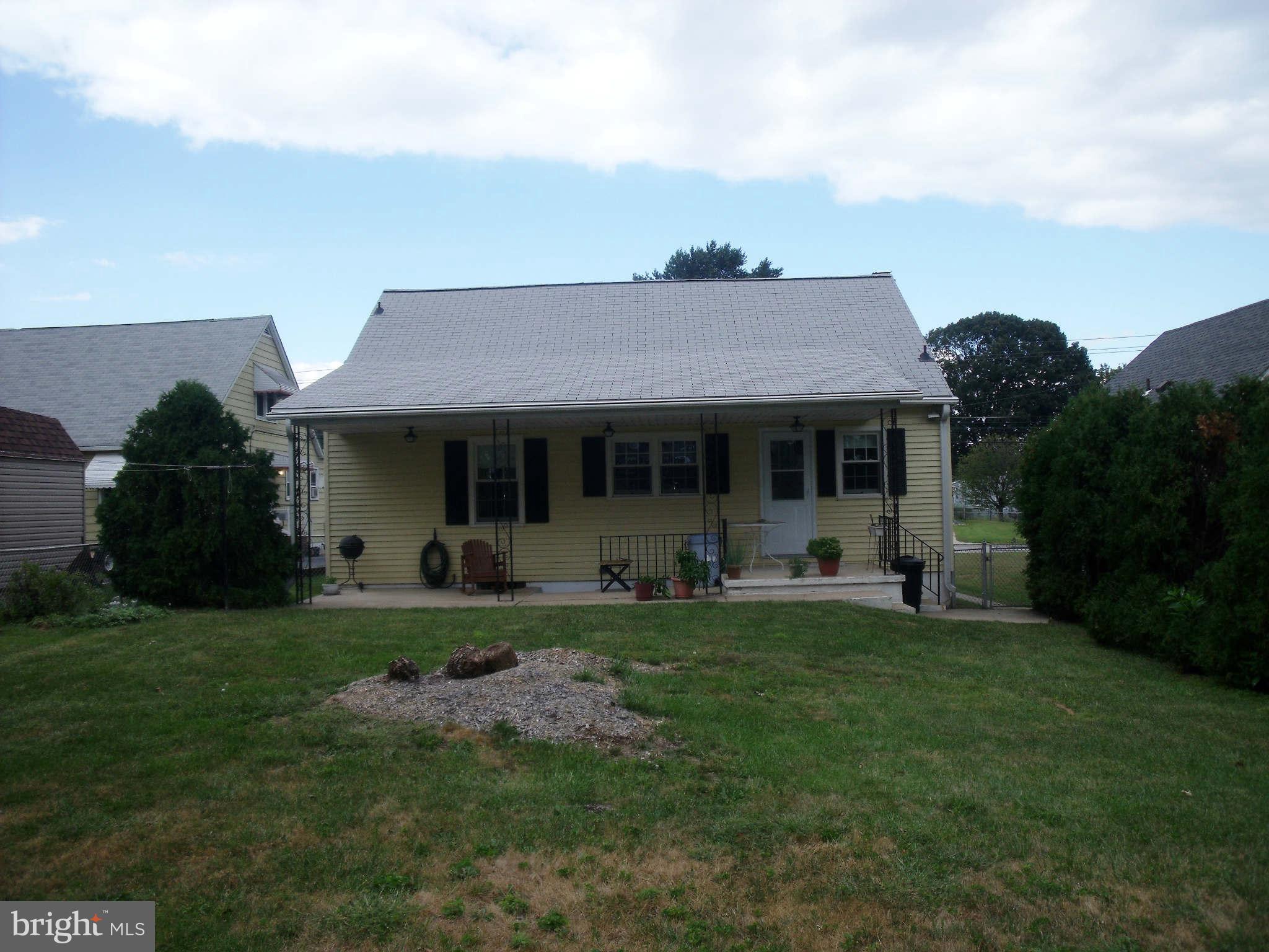 1209 Orems Road Baltimore, MD 21220 - Photo 8 of 29 a front view of a house with a garden and porch
