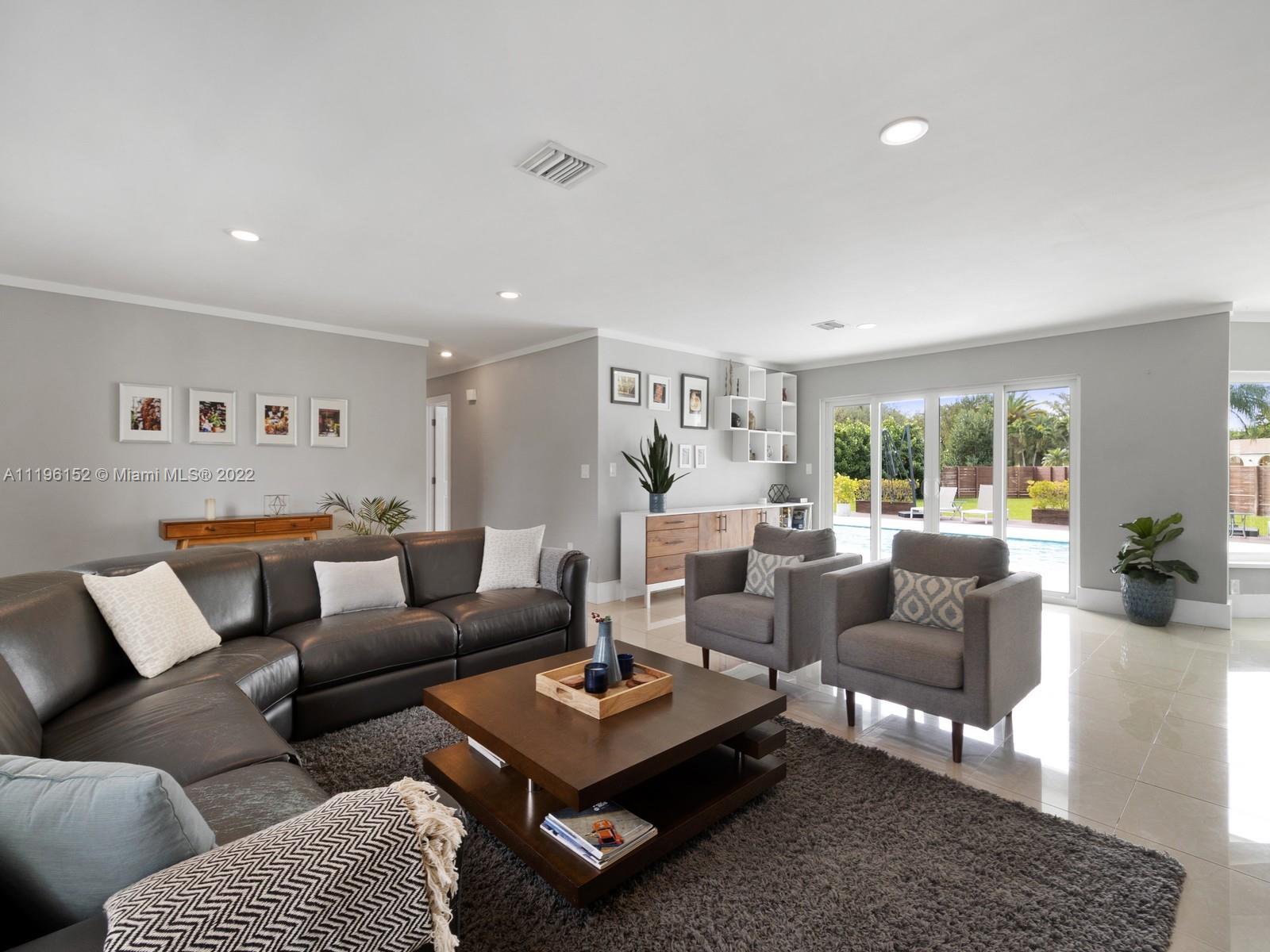 14250 Southwest 97th Avenue Miami, FL 33176 - Photo 11 of 38 a living room with furniture and a large window