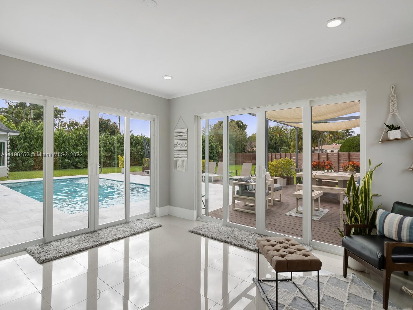 14250 Southwest 97th Avenue Miami, FL 33176 - Photo 18 of 38 a very nice looking room with a large window and dining area