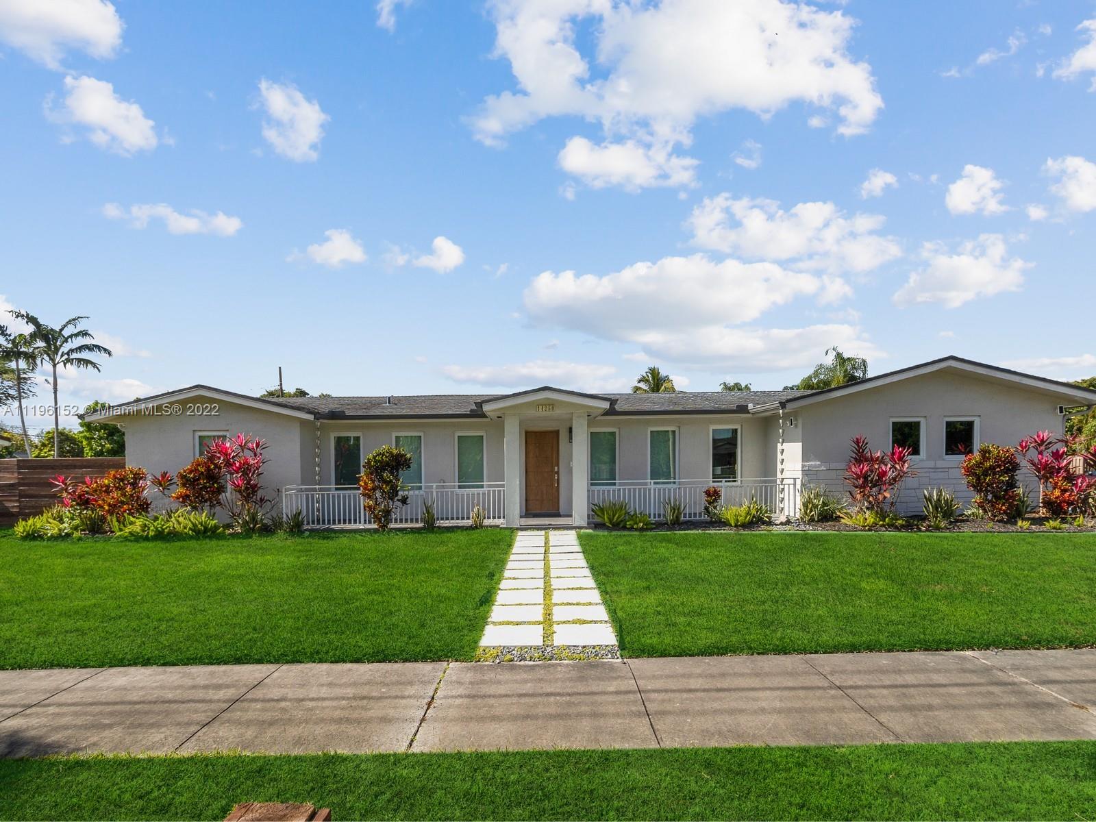 14250 Southwest 97th Avenue Miami, FL 33176 - Photo 2 of 38 a front view of house with yard and green space