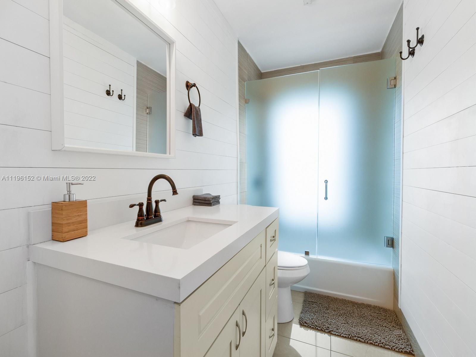 14250 Southwest 97th Avenue Miami, FL 33176 - Photo 24 of 38 a bathroom with a sink and a mirror