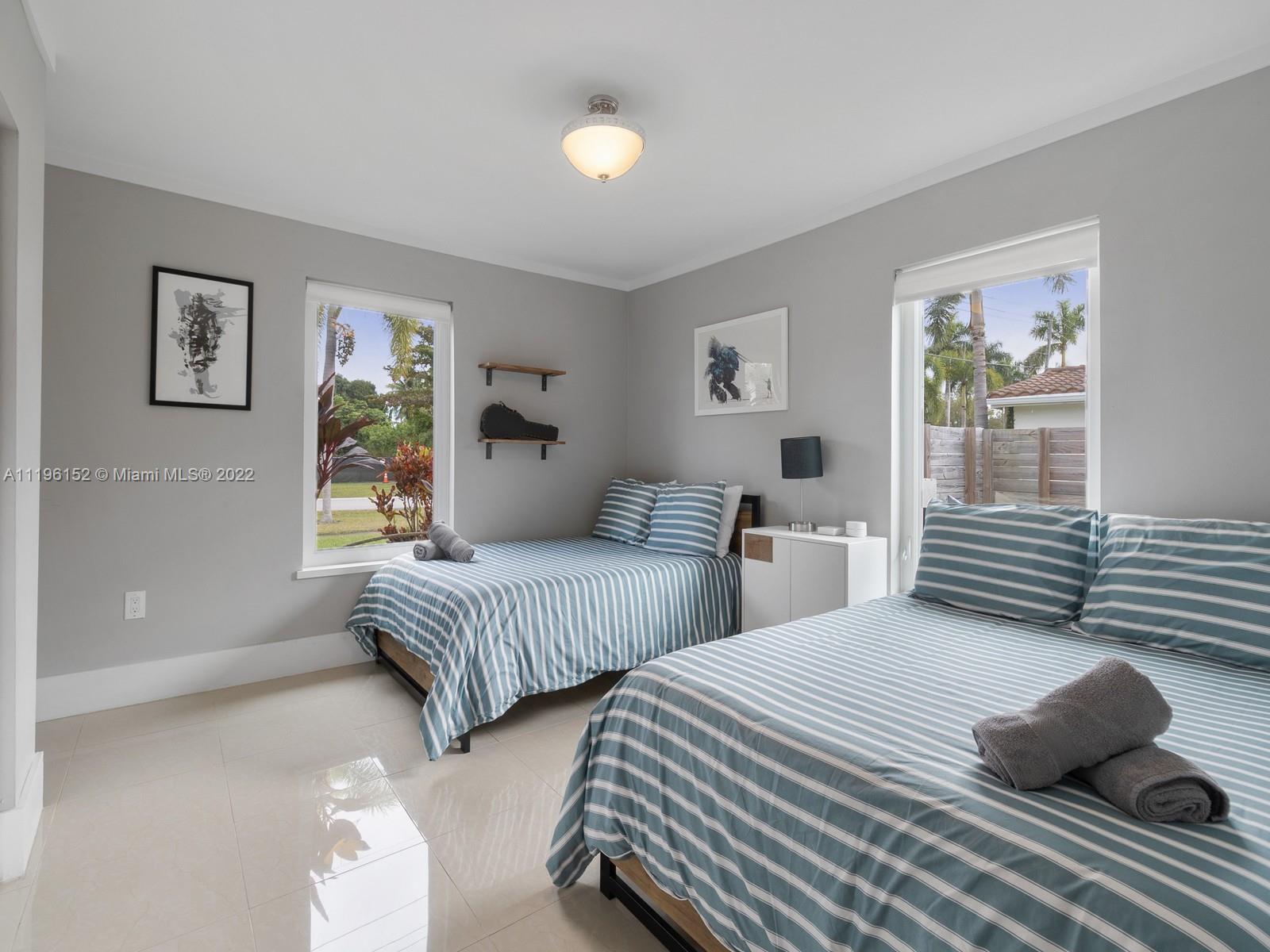 14250 Southwest 97th Avenue Miami, FL 33176 - Photo 25 of 38 a bedroom with two beds and a window