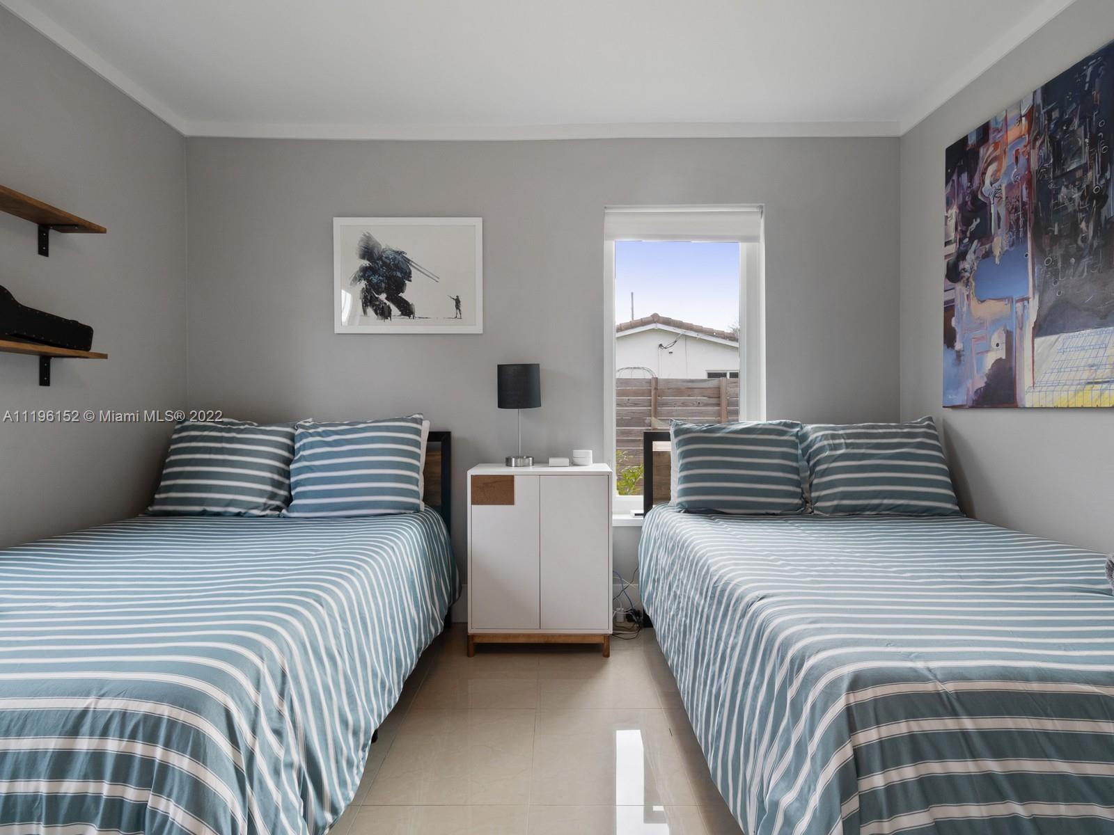 14250 Southwest 97th Avenue Miami, FL 33176 - Photo 26 of 38 a bedroom with a bed and a painting on the wall