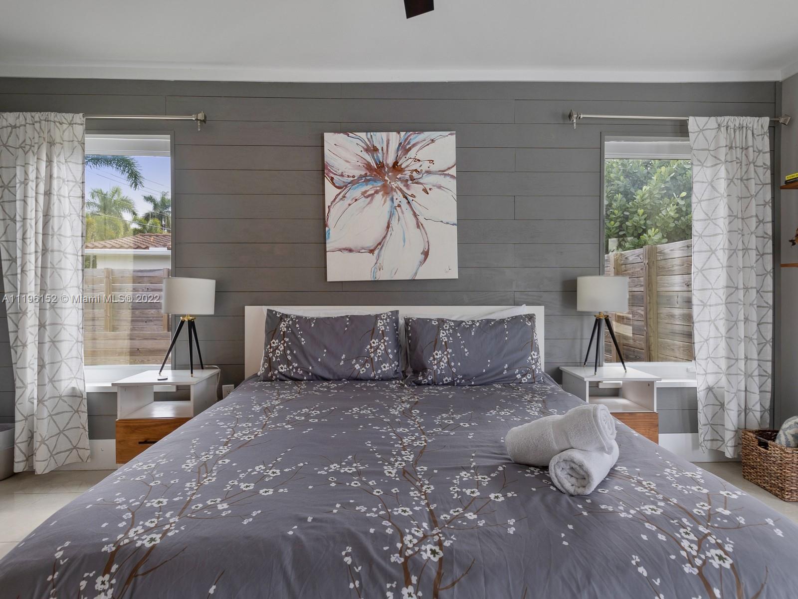 14250 Southwest 97th Avenue Miami, FL 33176 - Photo 27 of 38 a large bed sitting in a bedroom next to a window