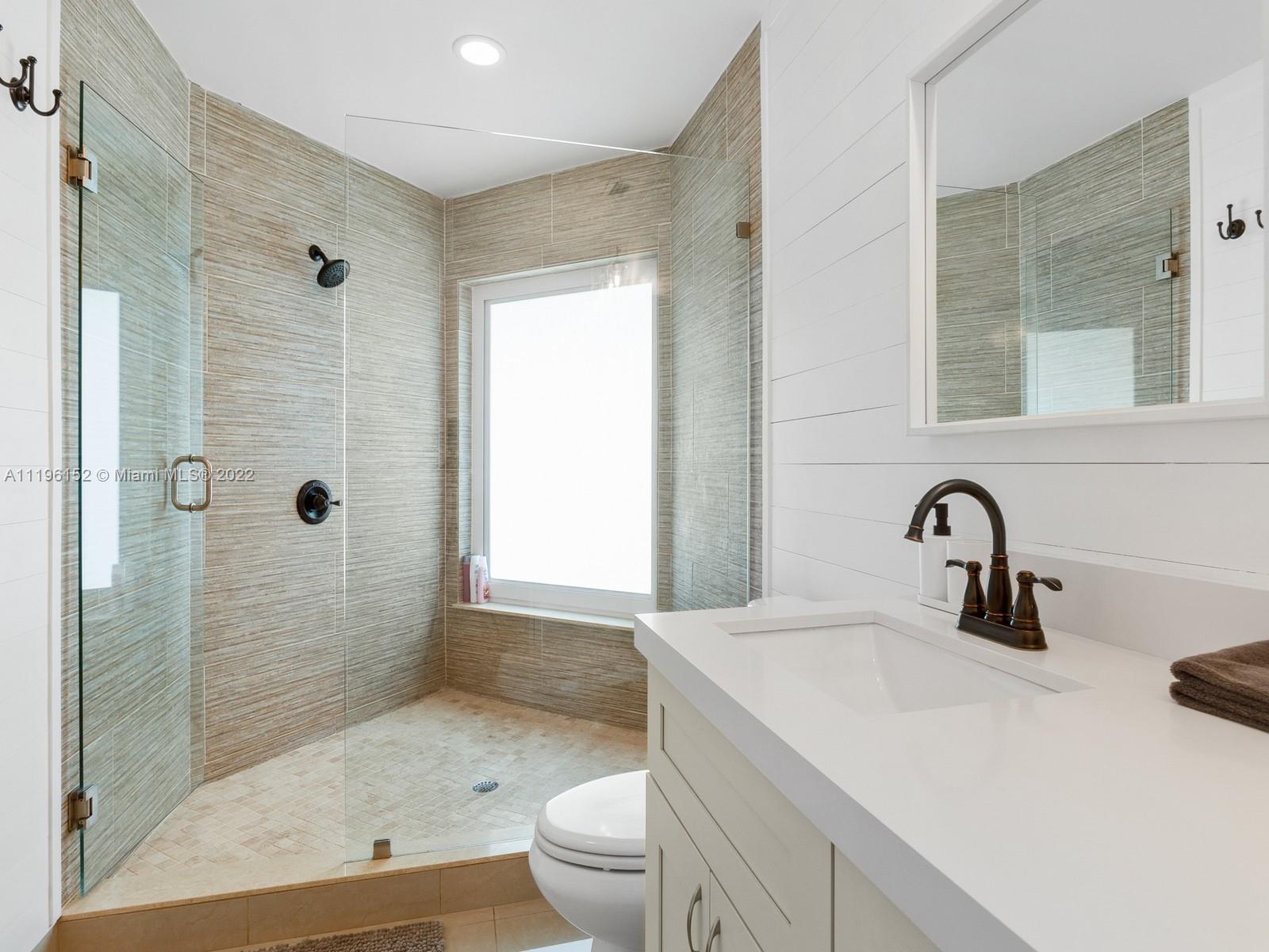 14250 Southwest 97th Avenue Miami, FL 33176 - Photo 31 of 38 a bathroom with a sink a toilet and shower