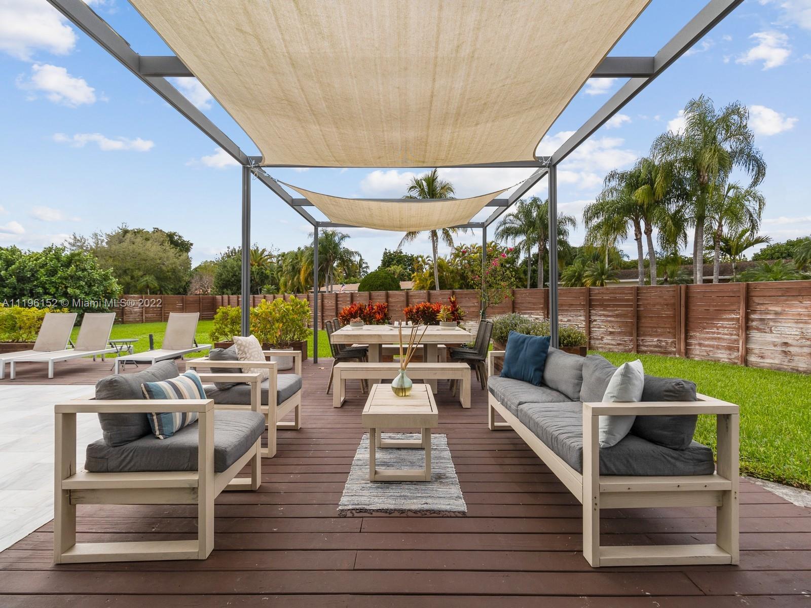14250 Southwest 97th Avenue Miami, FL 33176 - Photo 32 of 38 a outdoor space with patio the couches and dining table with chairs