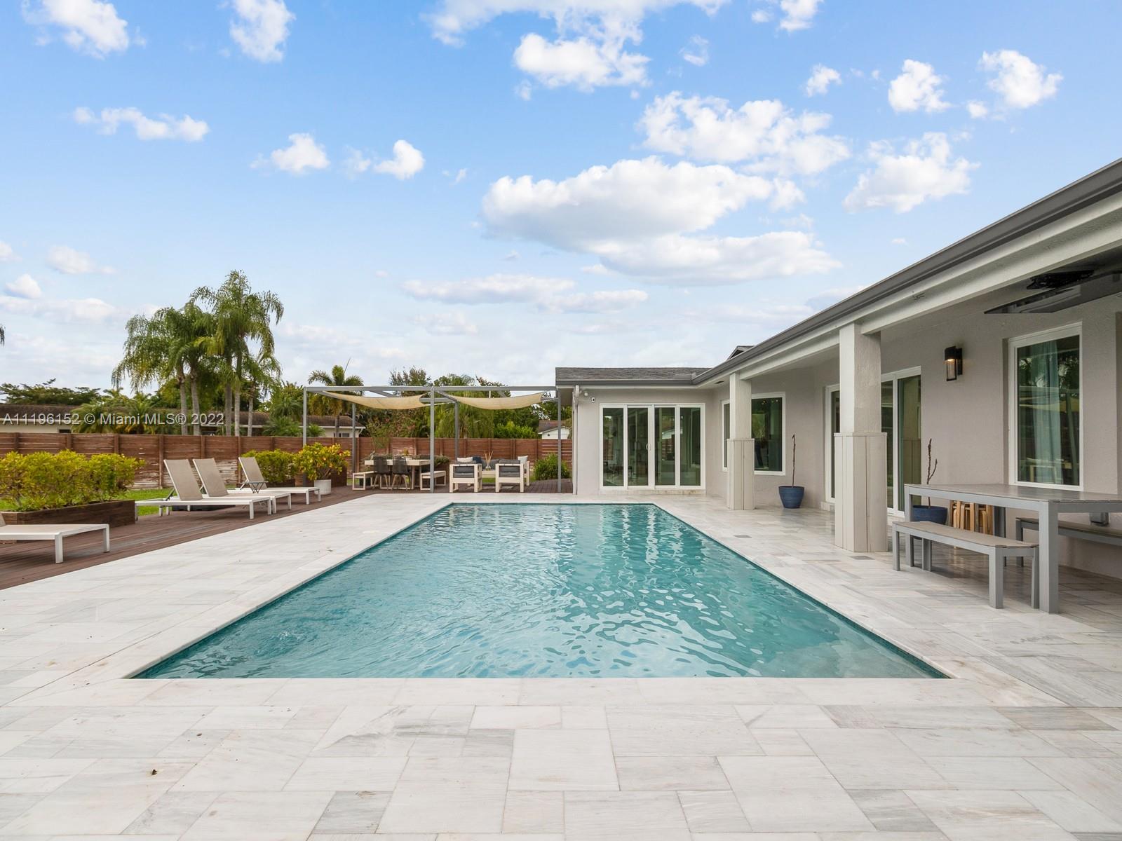 14250 Southwest 97th Avenue Miami, FL 33176 - Photo 35 of 38 a view of a house with swimming pool and sitting area