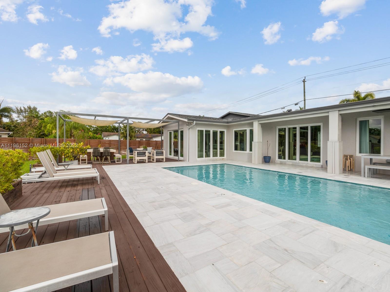 14250 Southwest 97th Avenue Miami, FL 33176 - Photo 36 of 38 a view of a house with a swimming pool