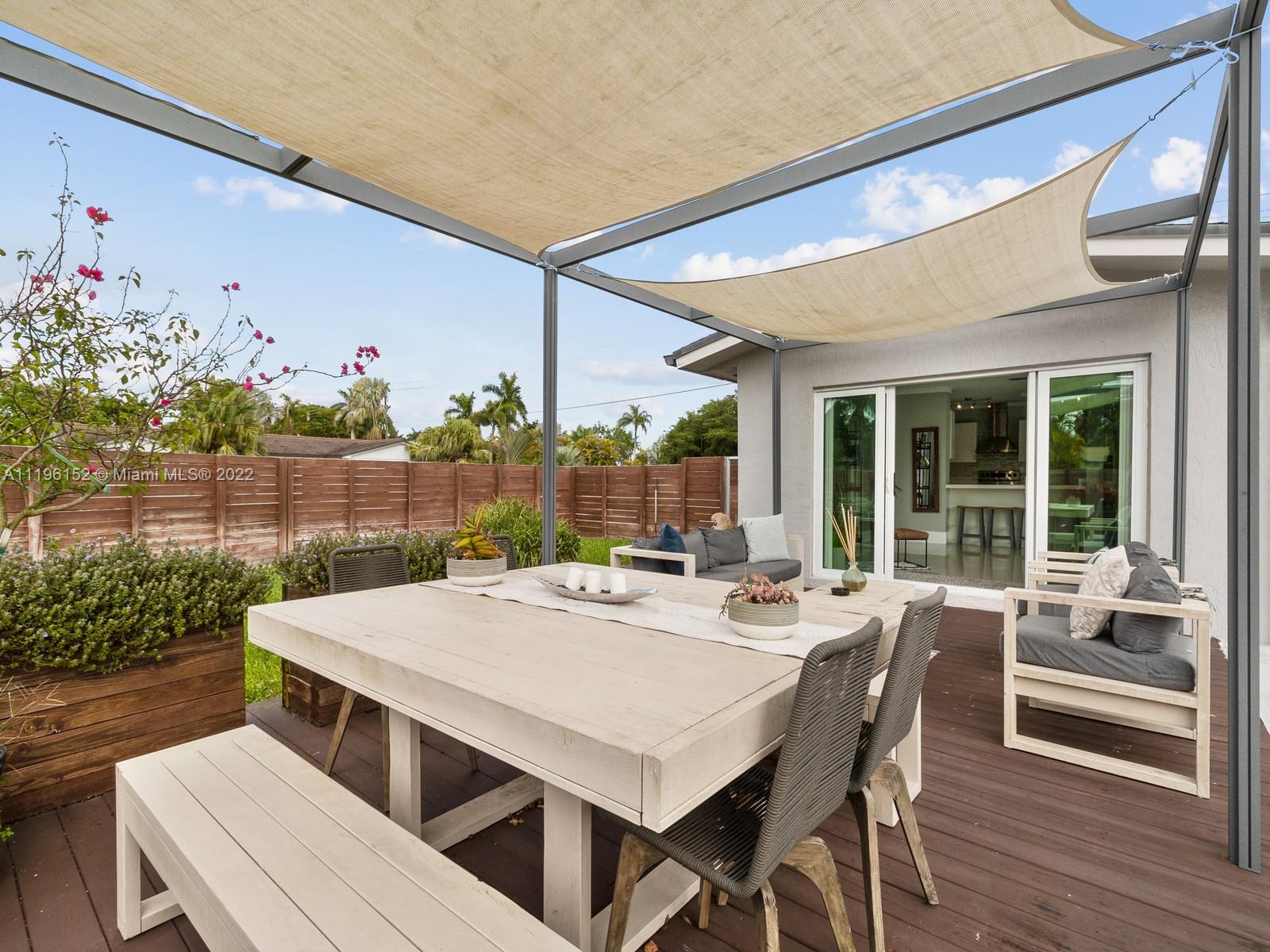 14250 Southwest 97th Avenue Miami, FL 33176 - Photo 38 of 38 a outdoor dining space with furniture and garden view