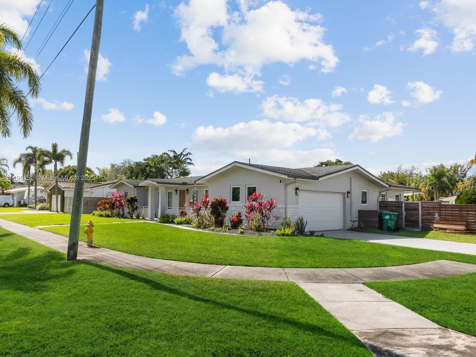 14250 Southwest 97th Avenue Miami, FL 33176 - Photo 6 of 38 a view of a house with a big yard and palm trees