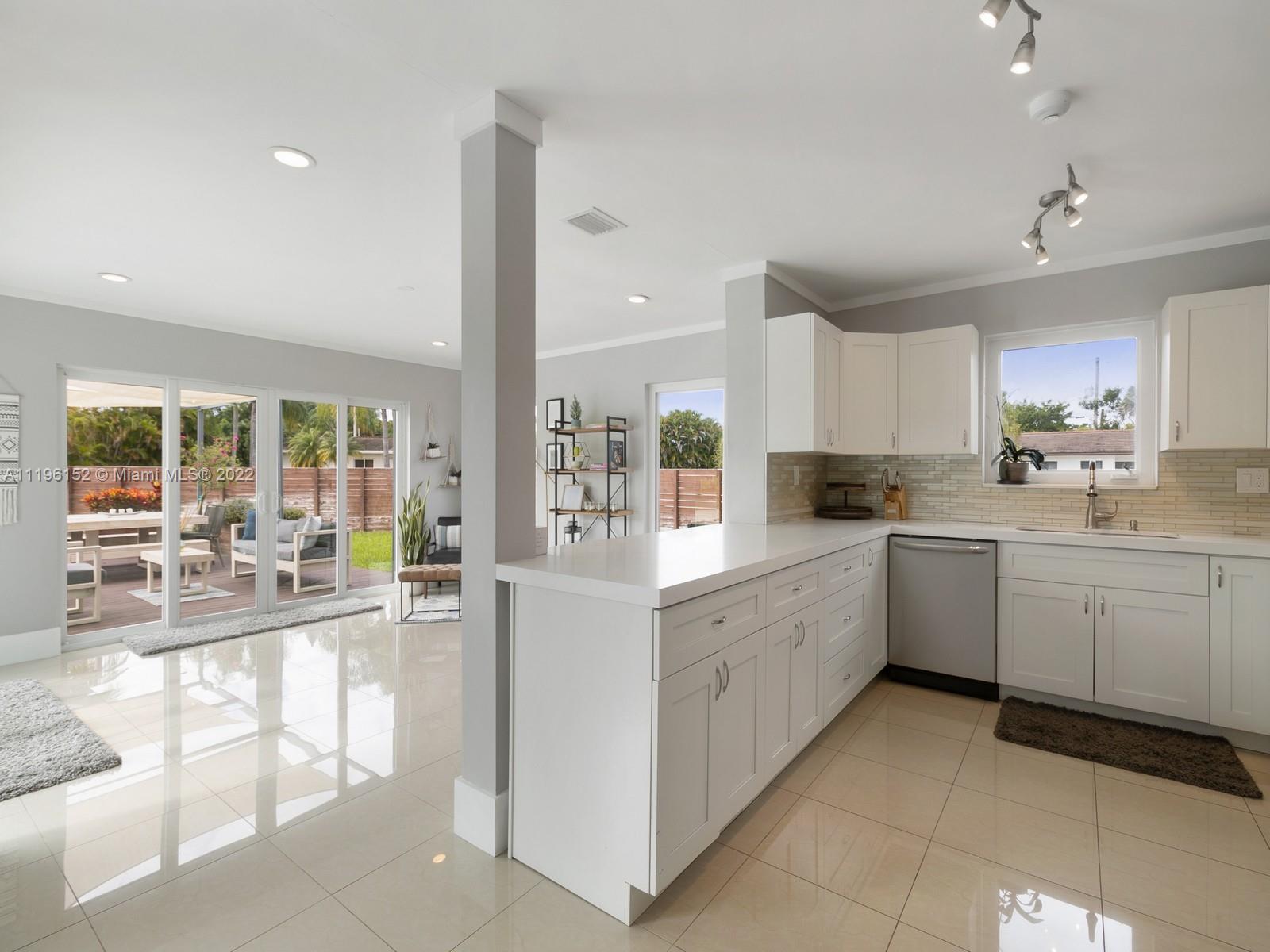14250 Southwest 97th Avenue Miami, FL 33176 - Photo 7 of 38 a kitchen with sink cabinets and appliances
